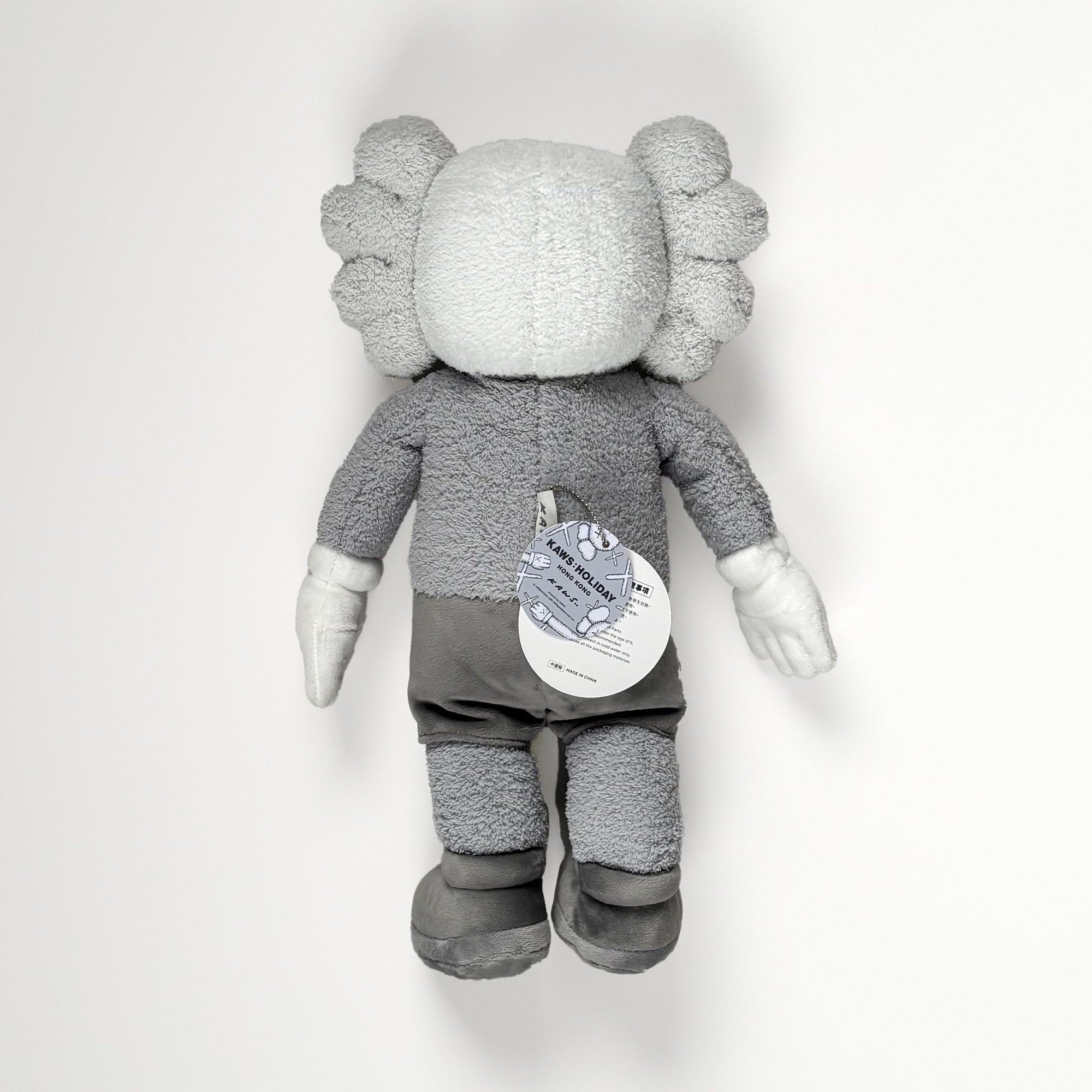 KAWS Hong Kong Holiday Plush, 2019, grey, back view