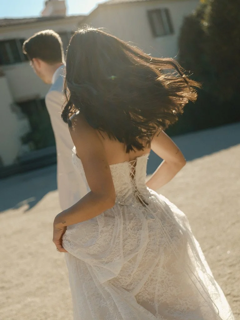 a bride and room running during bridal portrait as stonepine estate for a Jasper and Lane Events wedding