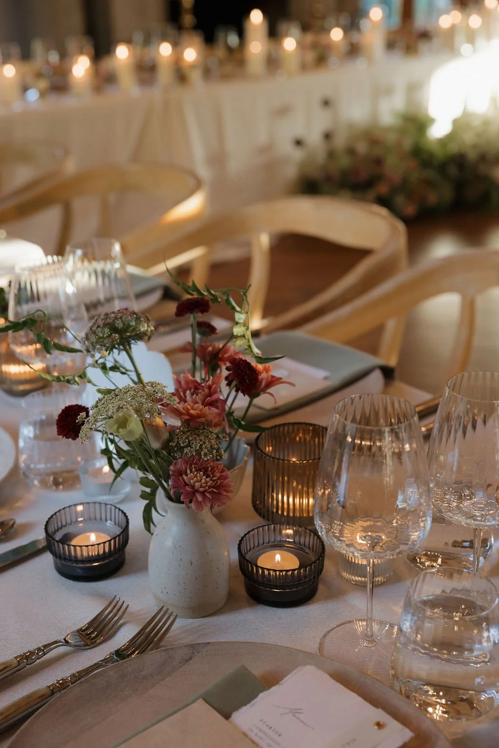 table setting with candles and flower detail designed by Jasper and Lane Events
