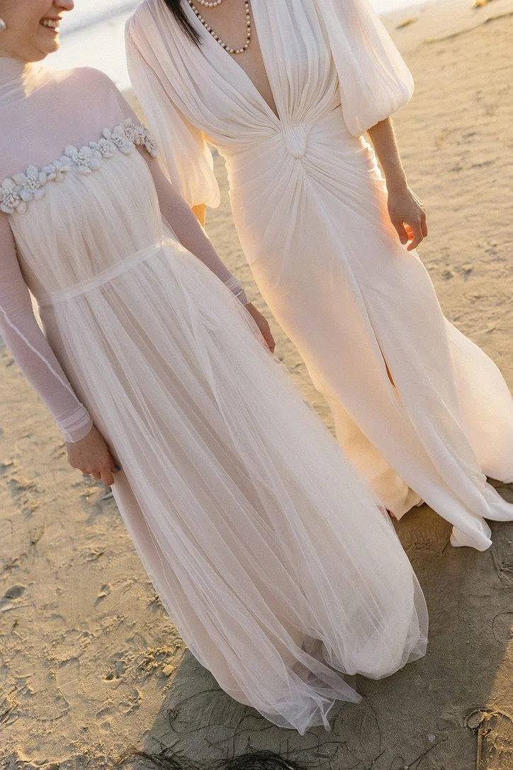A Jasper and Lane Events couple in their wedding gowns on the beach in la jolla