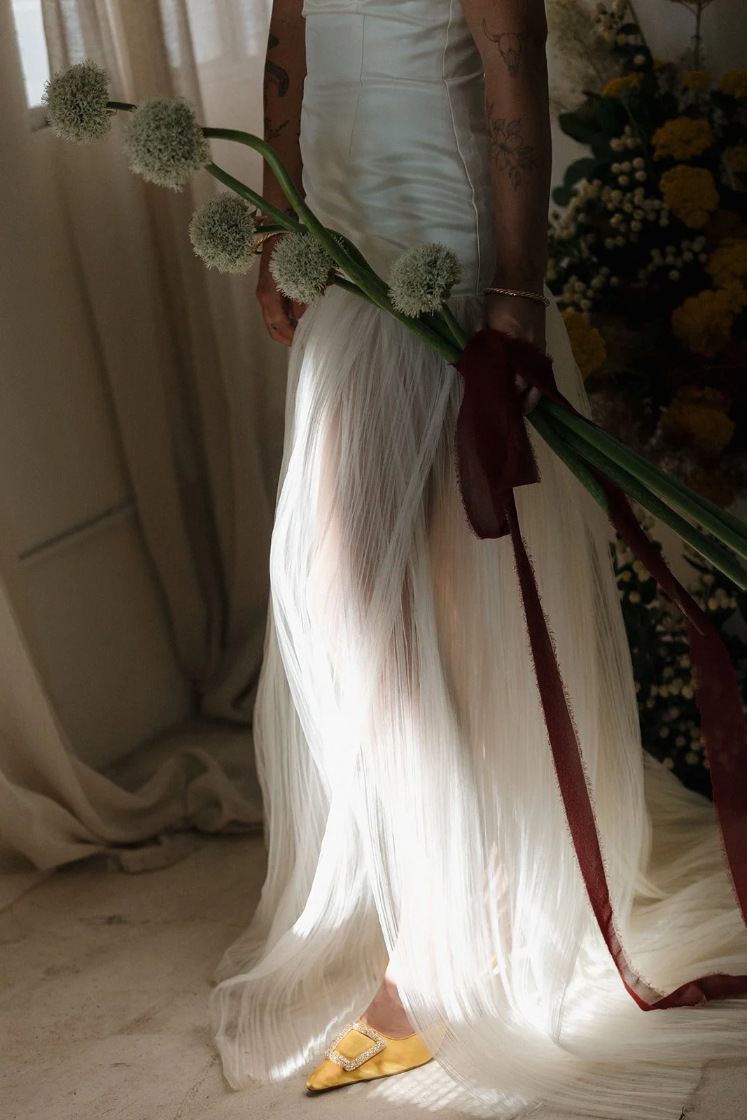 an shadowed lighting shot of a bride with an editorial bridal bouquet at a Jasper and Lane Events wedding 