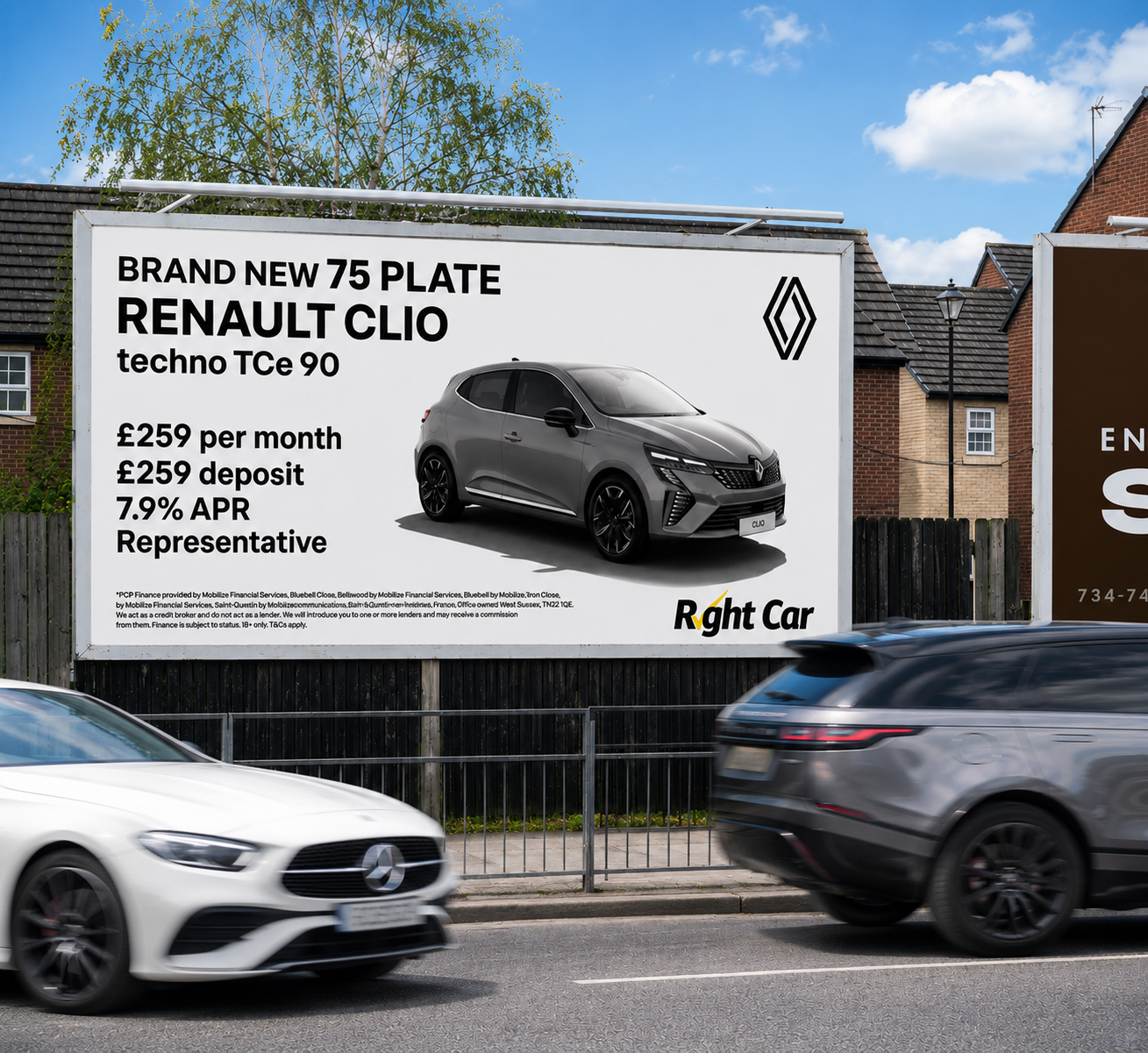 Large billboard advertising a new Renault Clio car model, showing a sleek gray car with pricing and finance options. Two cars are driving in front of the billboard on a city street with houses and blue sky in the background.