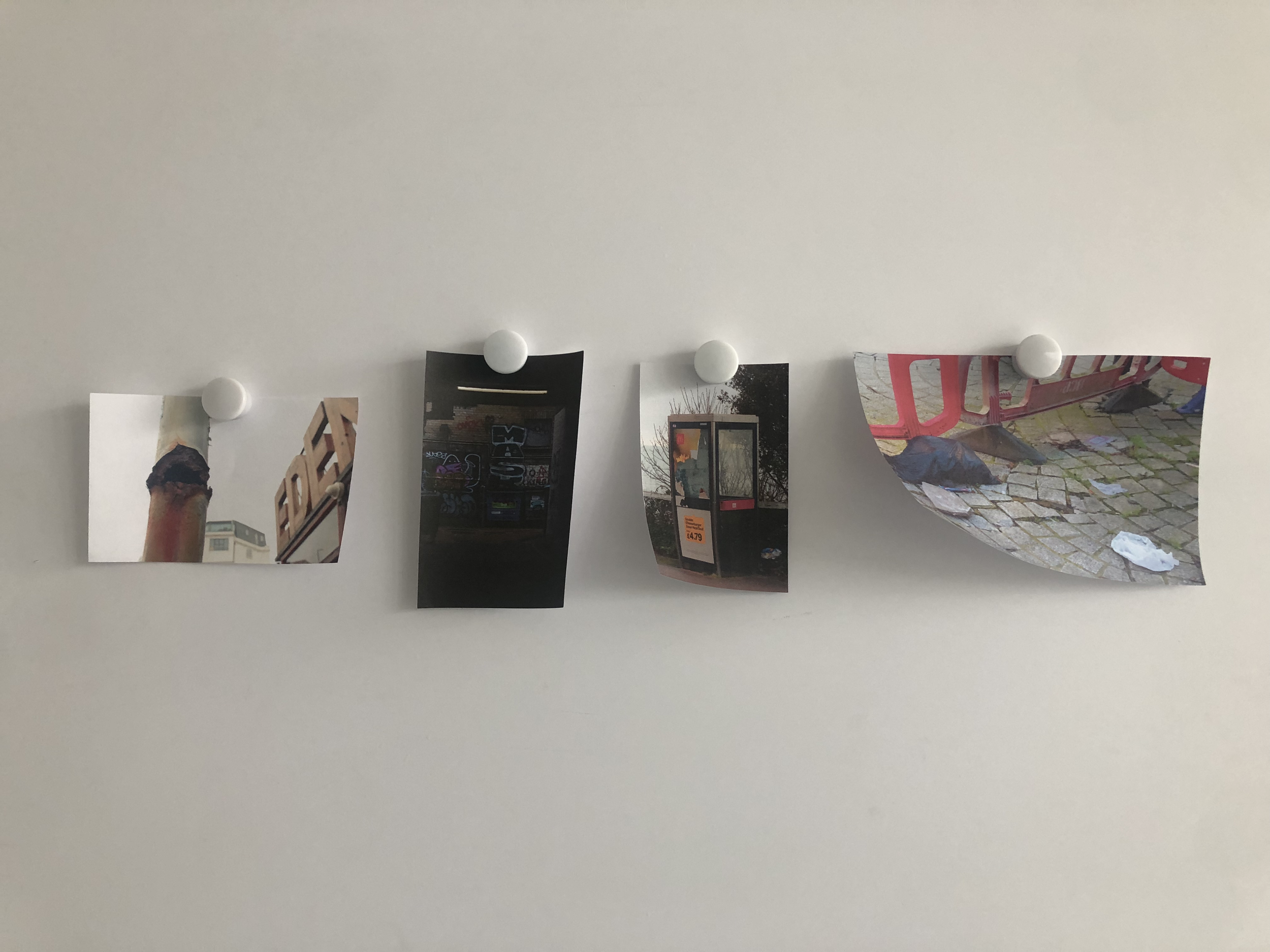 Five photographs of various urban and street scenes, randomly attached in a row on a white background.