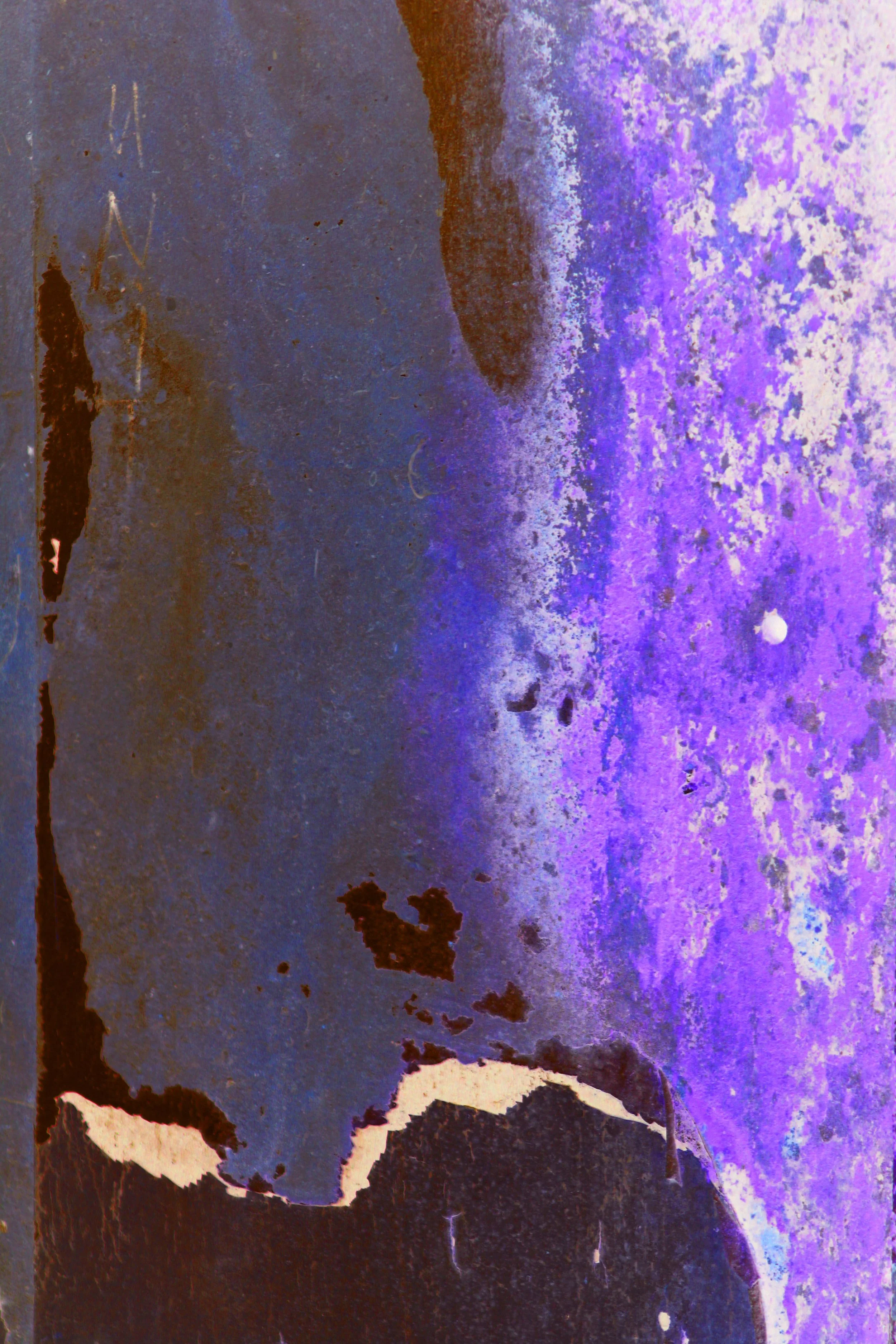Abstract, colorful image with shades of purple, blue, brown, and white, featuring a silhouette of a cat at the bottom and some textured patterns.