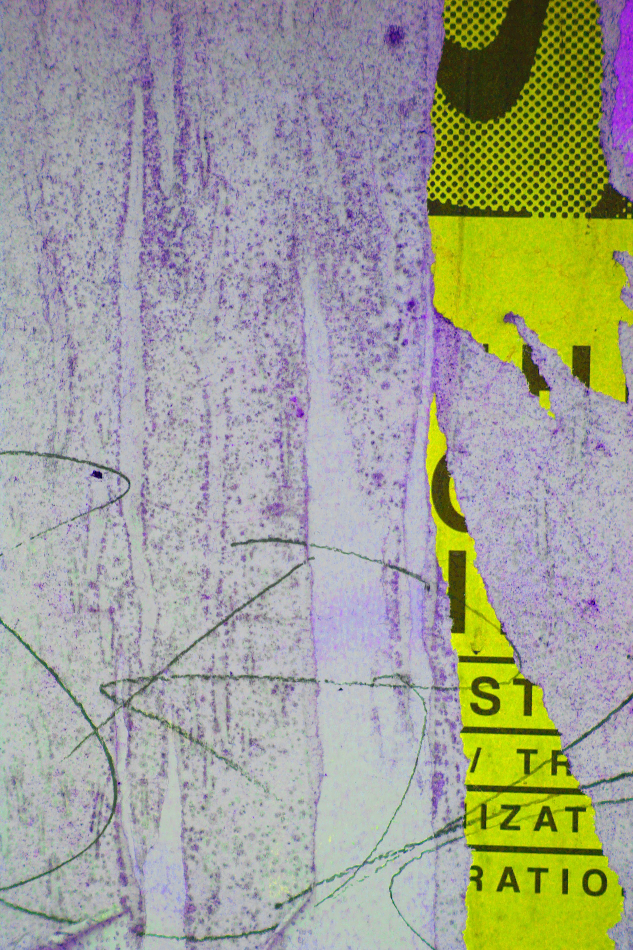 Close-up of a torn and weathered road sign with yellow background and black text, partially obscured. Overlapping a faded, cracked purple and white surface with faint outlines of a leaf.