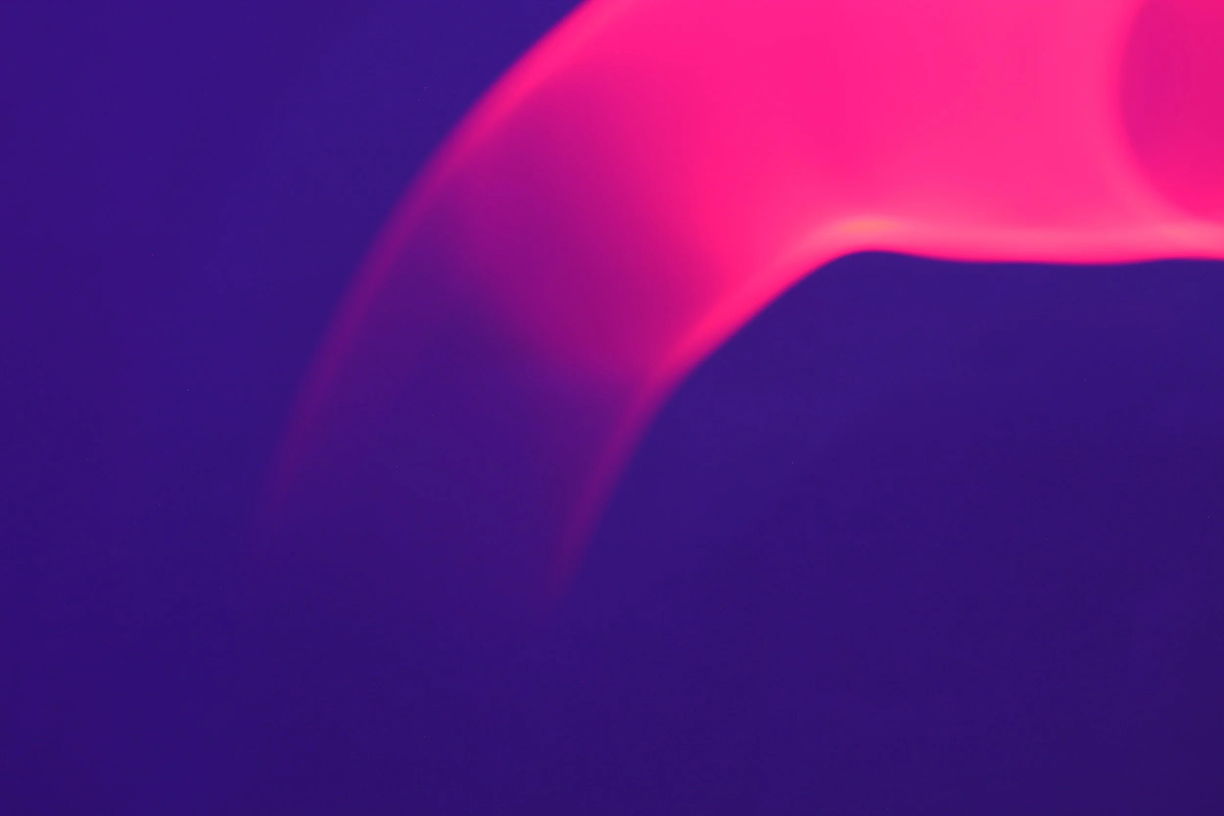 Abstract digital art with smooth gradient colors of pink and purple.
