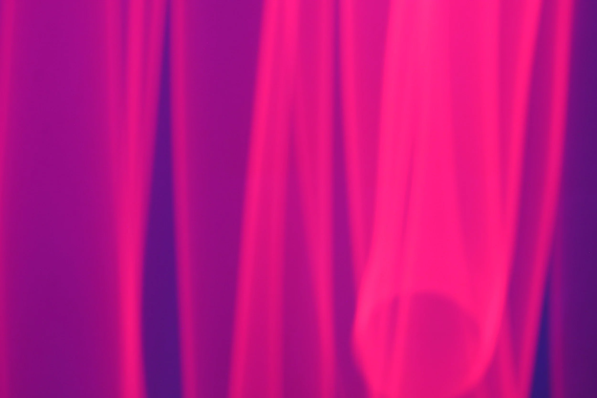 Abstract digital art with vertical pink and purple light streaks.