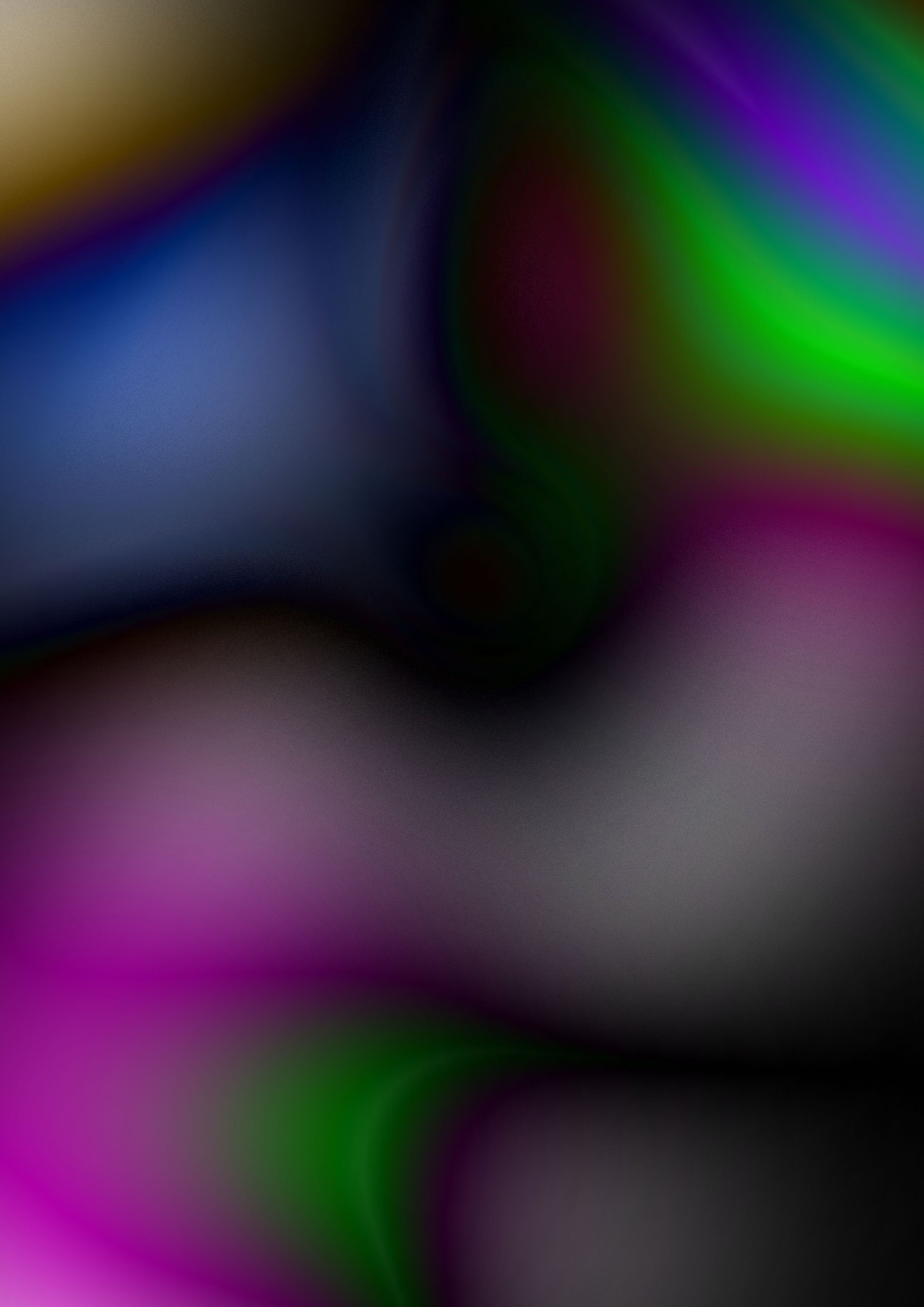 Abstract dark background with blurred vibrant streaks of purple, green, blue, and yellow colors