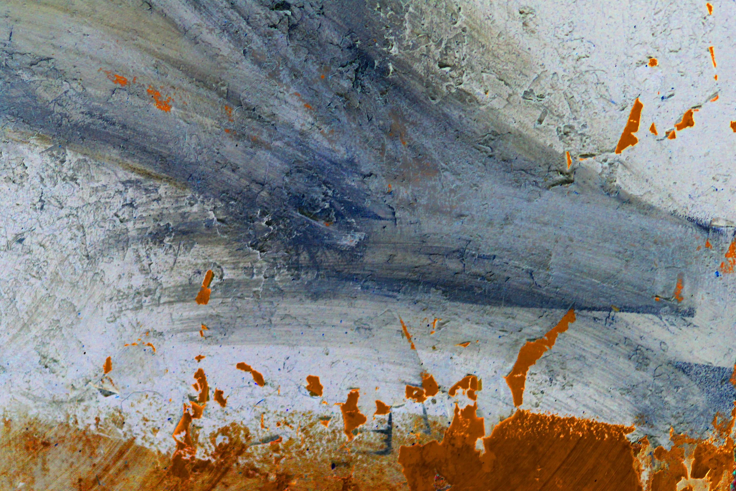 Close-up of a textured, weathered metal surface with patches of orange rust and areas of peeling paint.