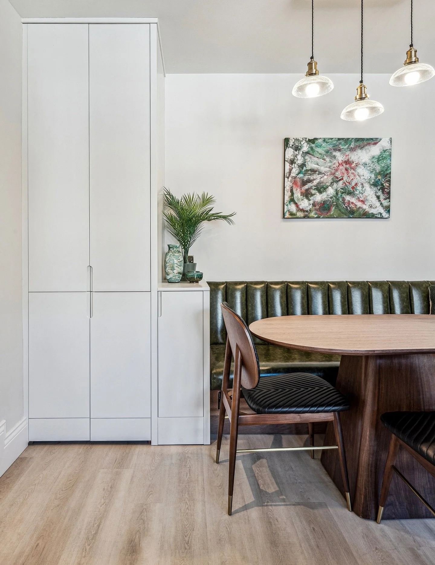 Bespoke dining nook meets smart storage.
We integrated full-height cabinetry with a tailored dining bench, balancing minimal lines with tactile comfort. A quiet moment to pause, framed in timber and texture.