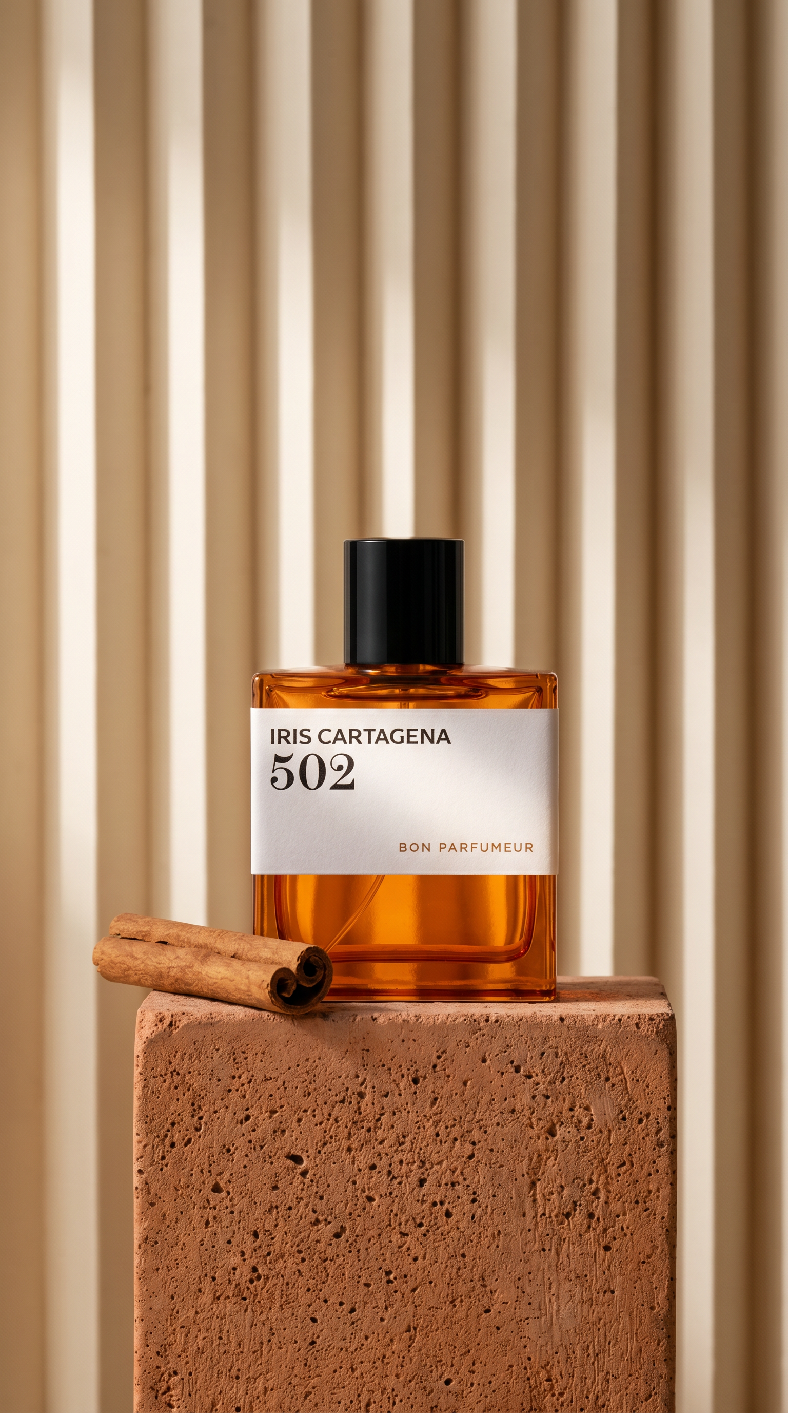 A rigid background contrasts with the clay structure that holds the fragrance standing boldly alongside a single cinnamon stick.