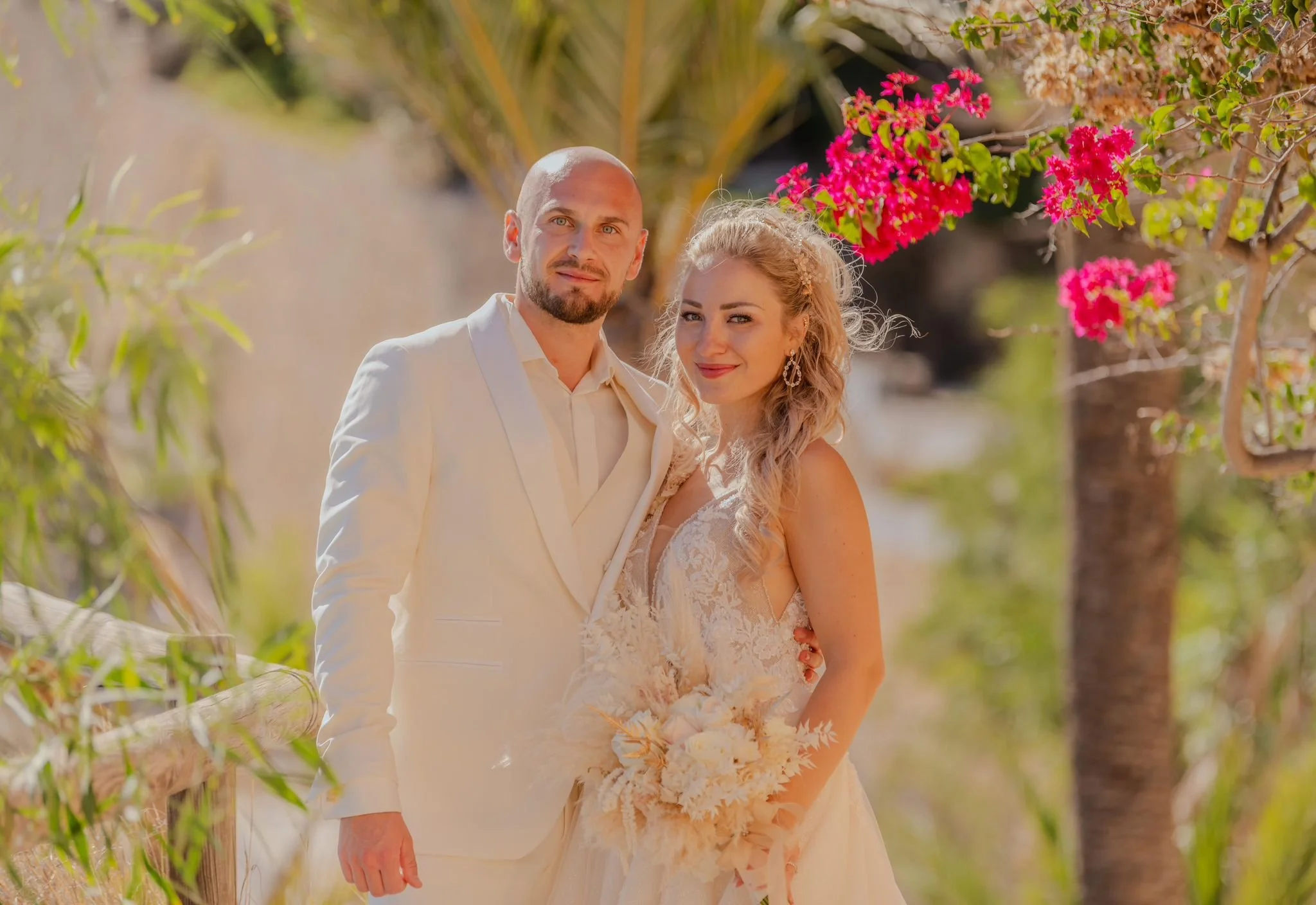 Romantic garden elopement ceremony with lush greenery and floral styling in Spain