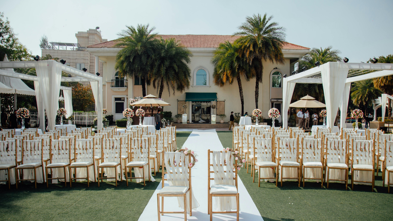 Outdoor wedding ceremony setup at a luxury villa near Moraira with guest chairs and twin pergolas for shade