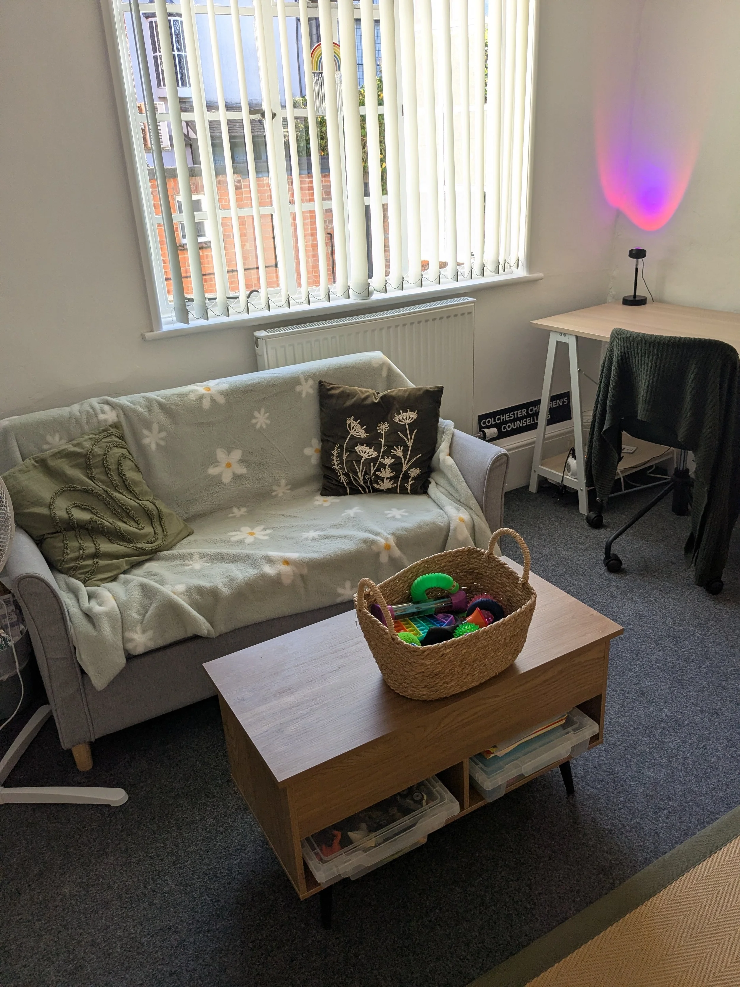 Jute Room sofa and fidget toys