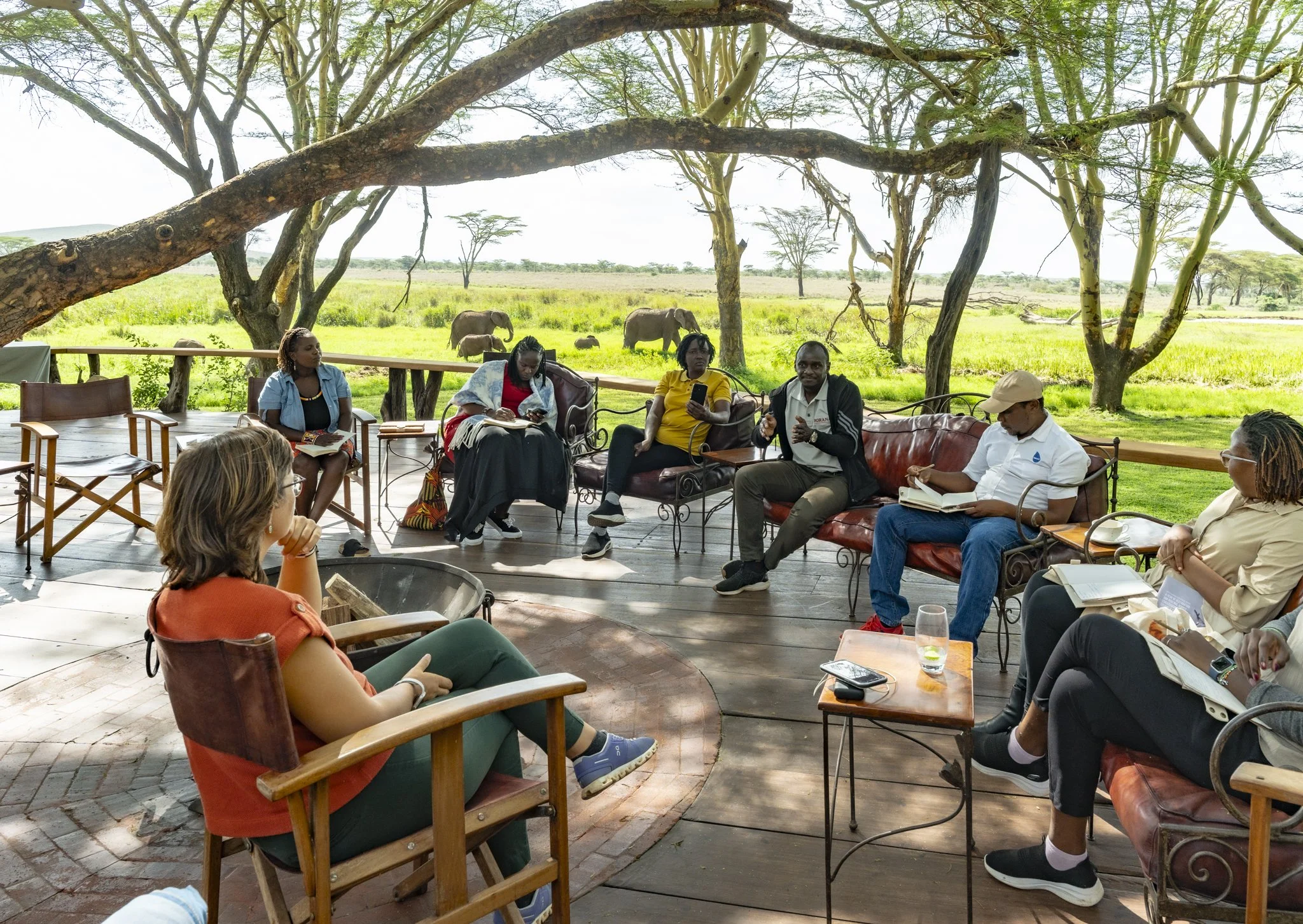 The Long Run members at one of the sessions at Sirikoi during the AGM with a herd of elephants in the background.