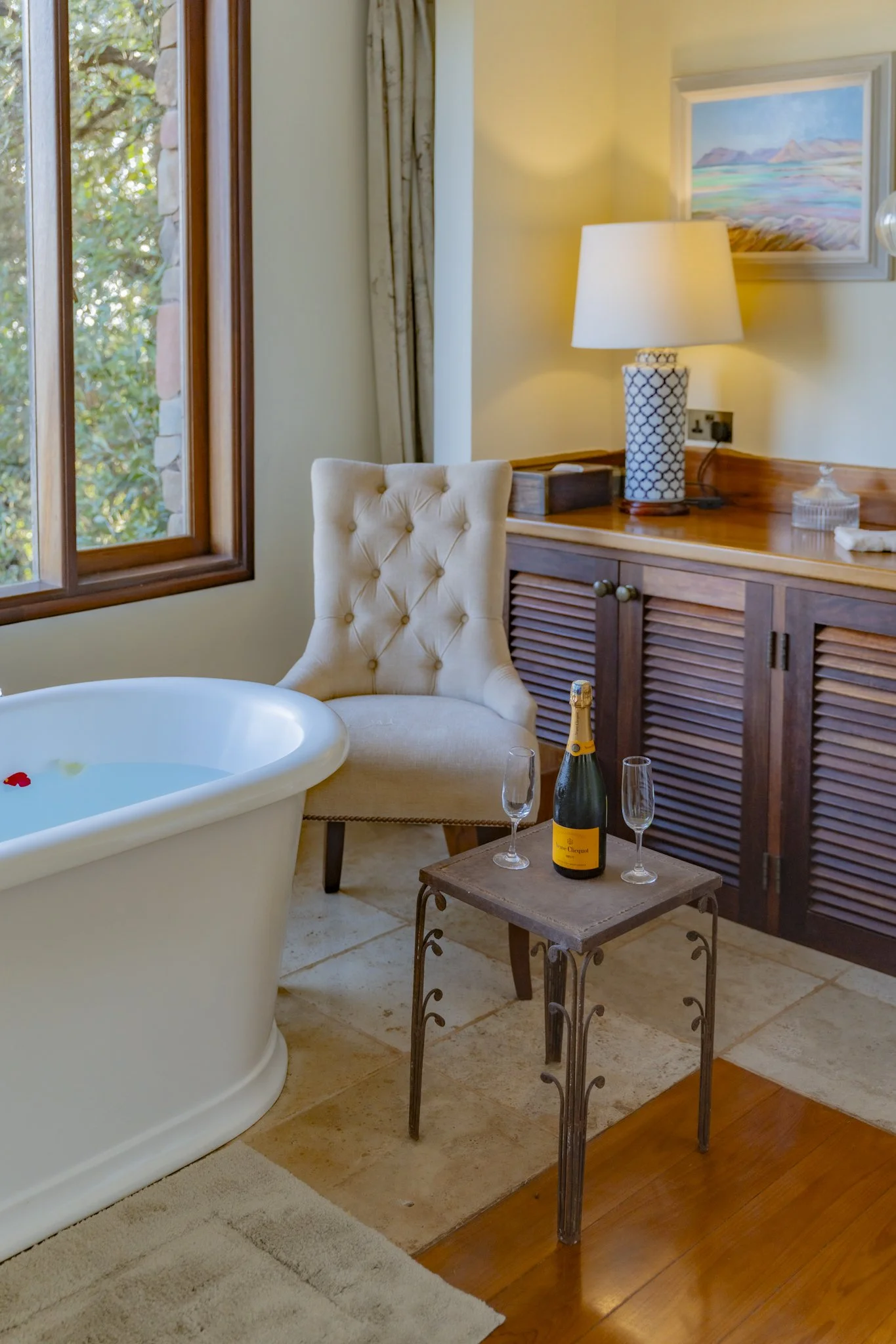Bathtub with champagne ready for guests