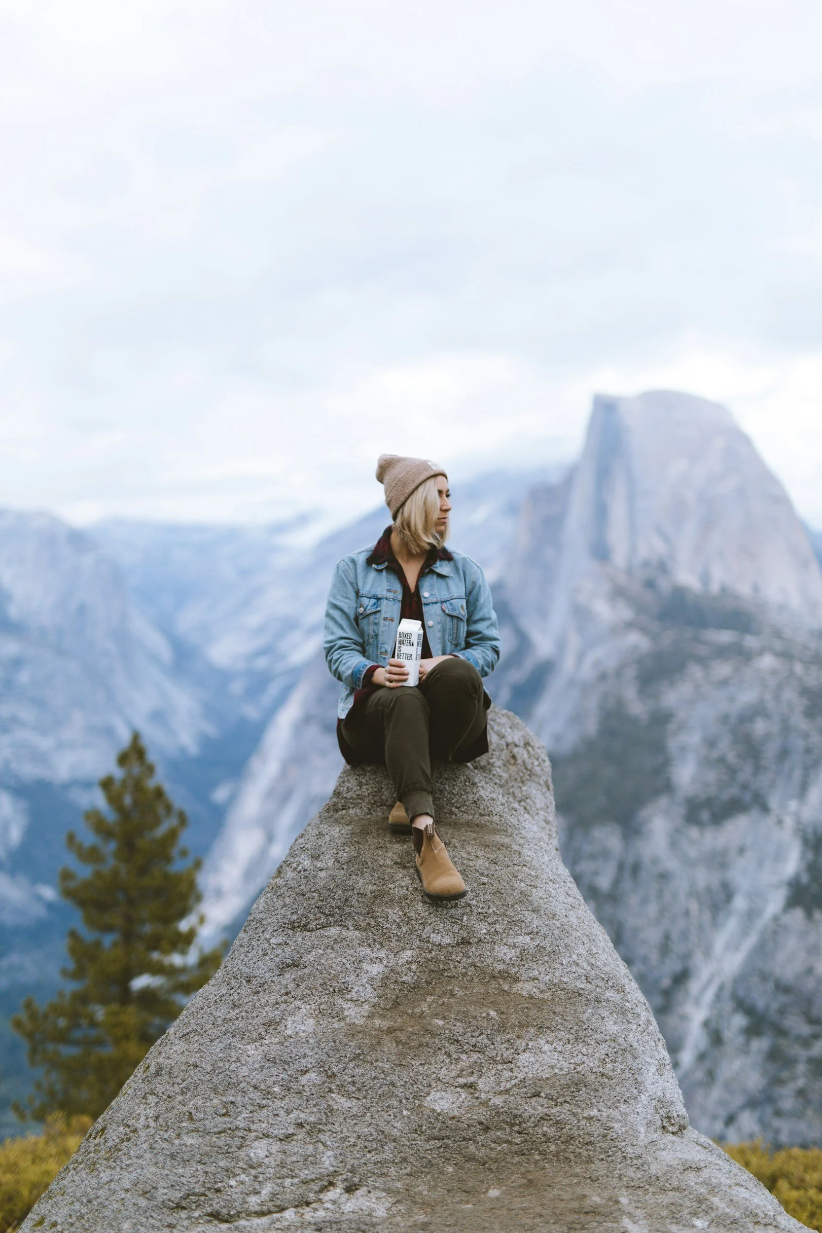 Individual on mountain representing personal growth journeys and self-discovery