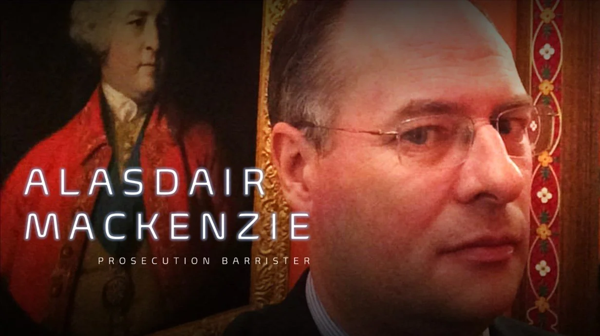 Close-up of a man with glasses in front of a portrait of a historical figure with dark hair, wearing a red coat and white shirt, and the text 'ALASDAIR MACKENZIE PROSECUTION BARRISTER'.
