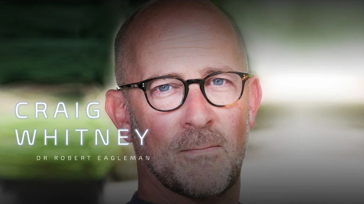 Close-up of a man with glasses, short beard, and bald head, with text overlay showing the name Craig Whitney and Dr. Robert Eagleman.