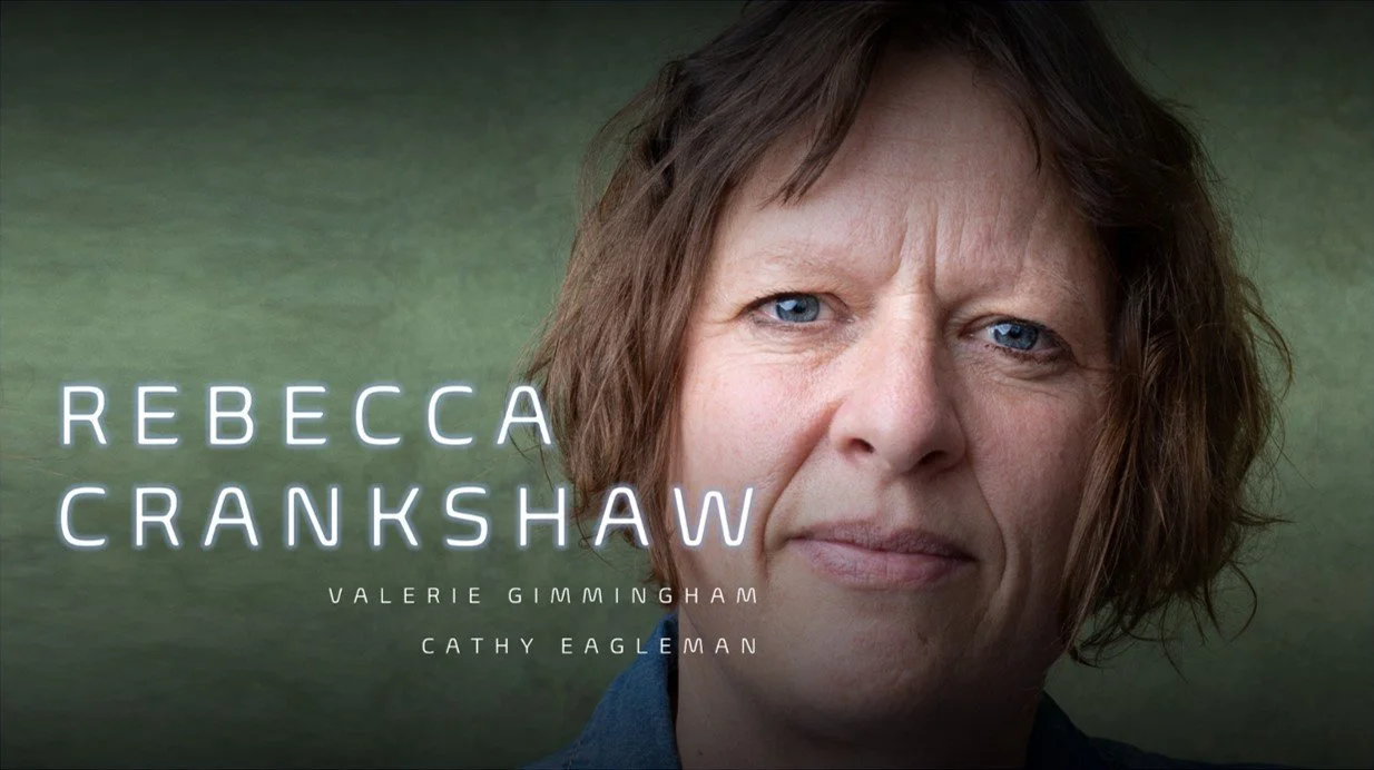 Close-up of a woman with short brown hair and blue eyes, looking directly at the camera, with text displaying the names Rebecca Crankshaw, Valerie Gimmingham, and Cathy Eagleman.
