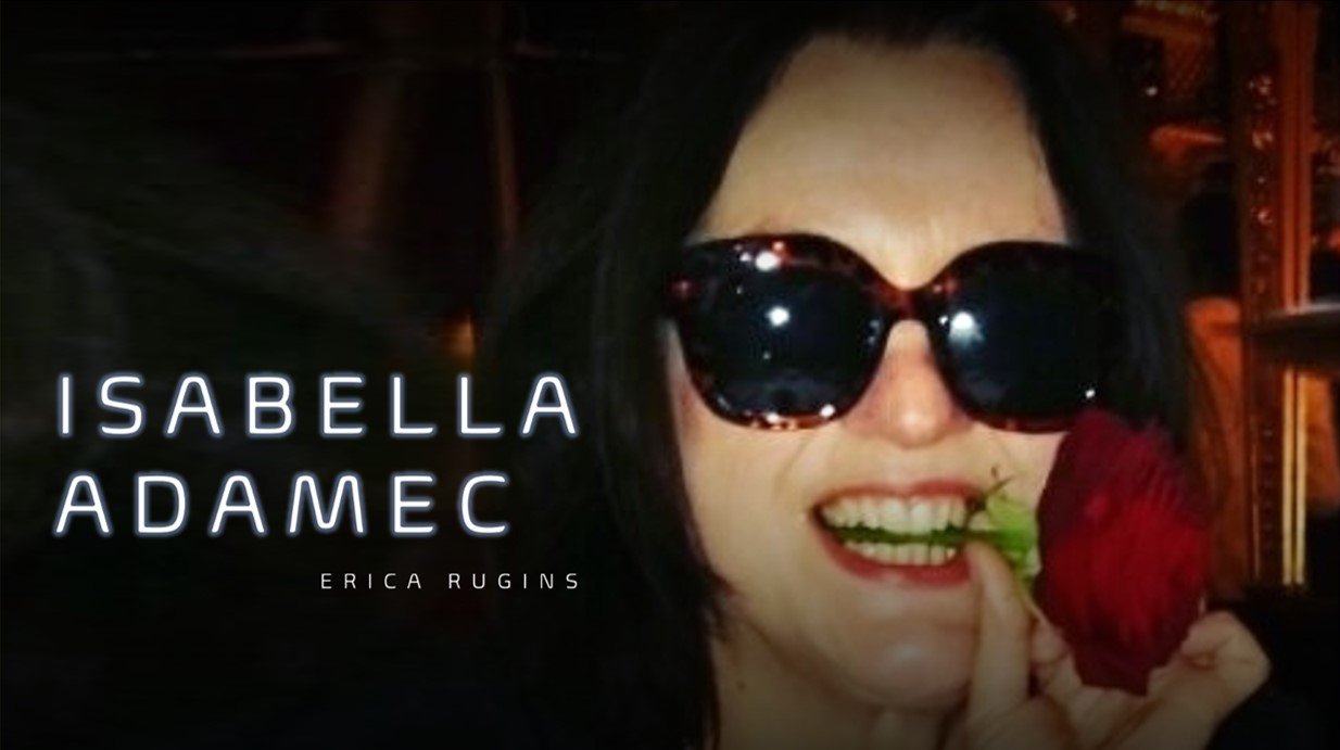 A woman smiling while holding a red rose near her mouth, wearing large black sunglasses and red lipstick, with text overlaying her face that reads 'Isabella Adamec' and 'Erica Rugins'.