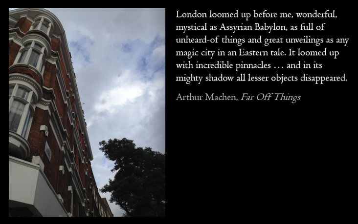 Photograph of a historic red brick building with intricate white architectural details and rounded windows, alongside a tree and a cloudy sky.