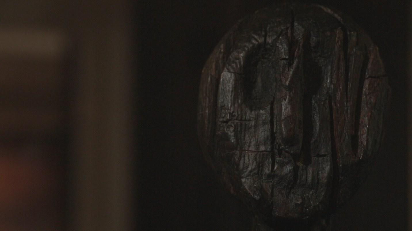 The Dagenham Idol. A dark, round, cracked wooden effigy. One of the oldest representations of a human, or possibly a god, found in Britain.