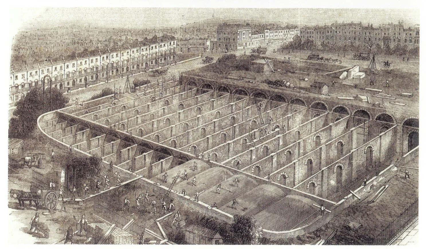 Historical black and white illustration of a construction site with a large foundation being built, surrounded by early 20th-century buildings, horse-drawn carts, and workers.  Building the Claremont Square reservoir, 1855.