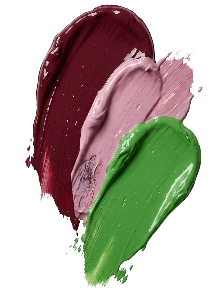 Swatches of red, pink, and green paint smeared on a surface.