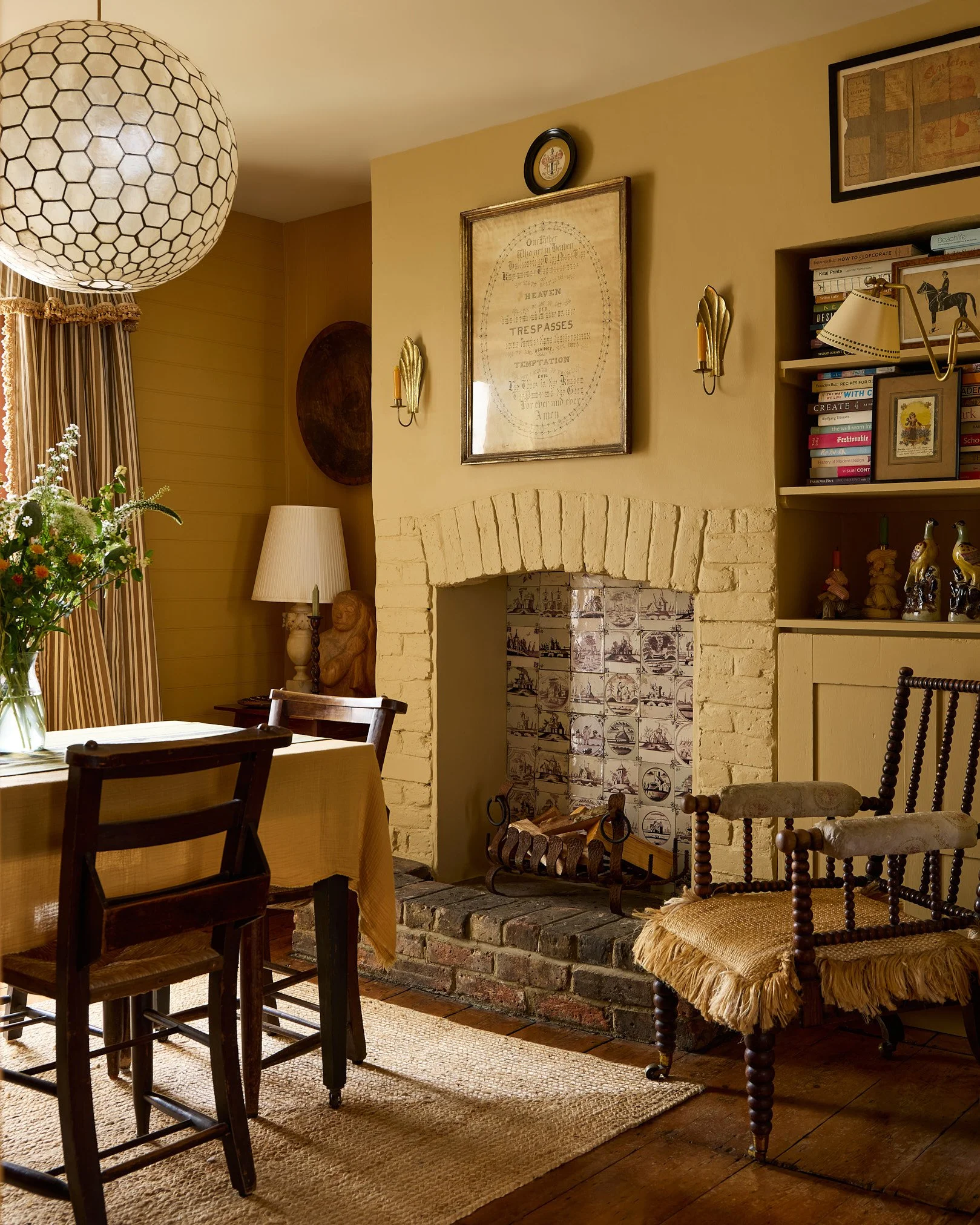 Georgian cottage living room with restored floorboards and period fireplace