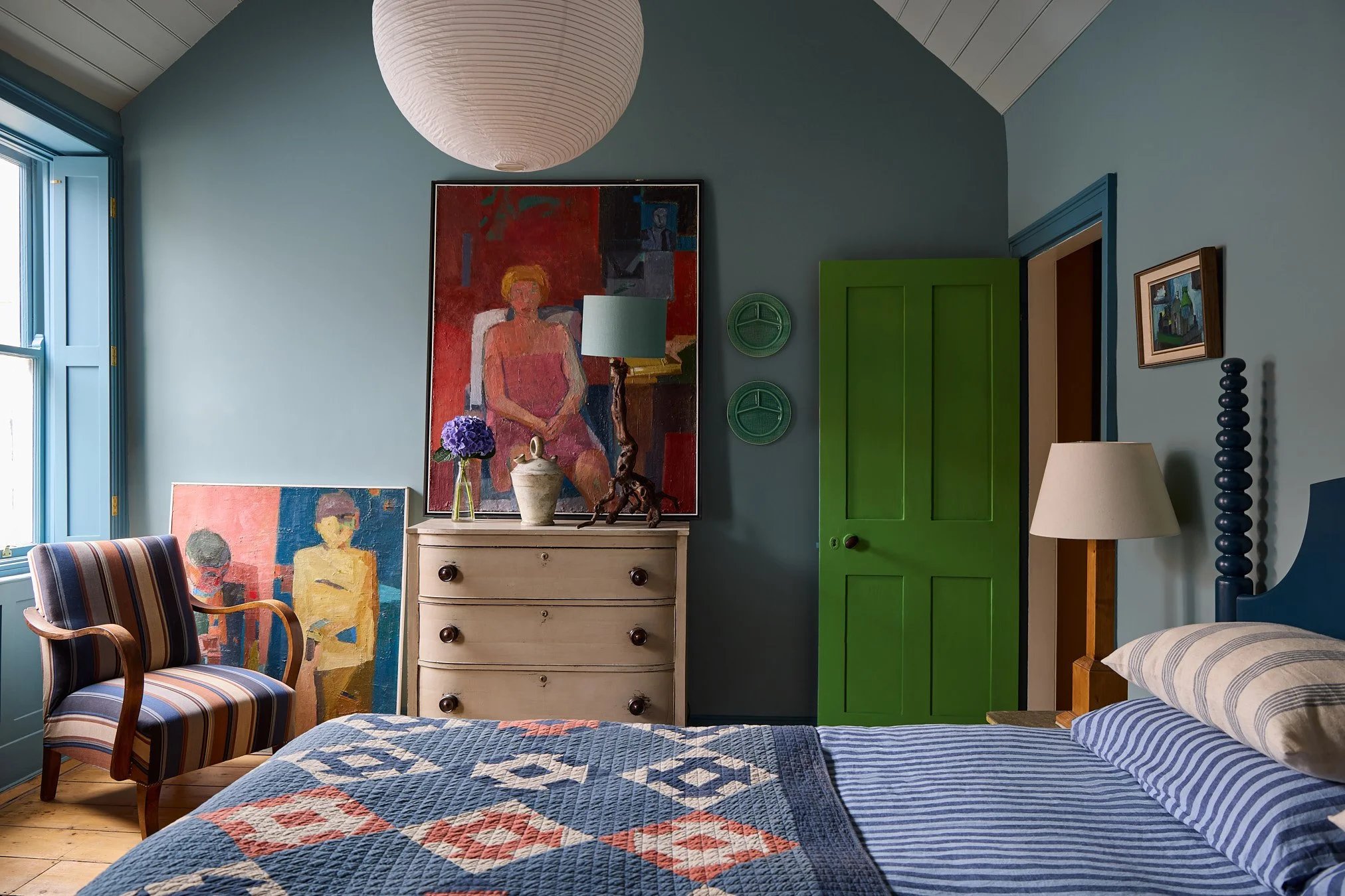 Blue bedroom in Georgian cottage with bold colour scheme