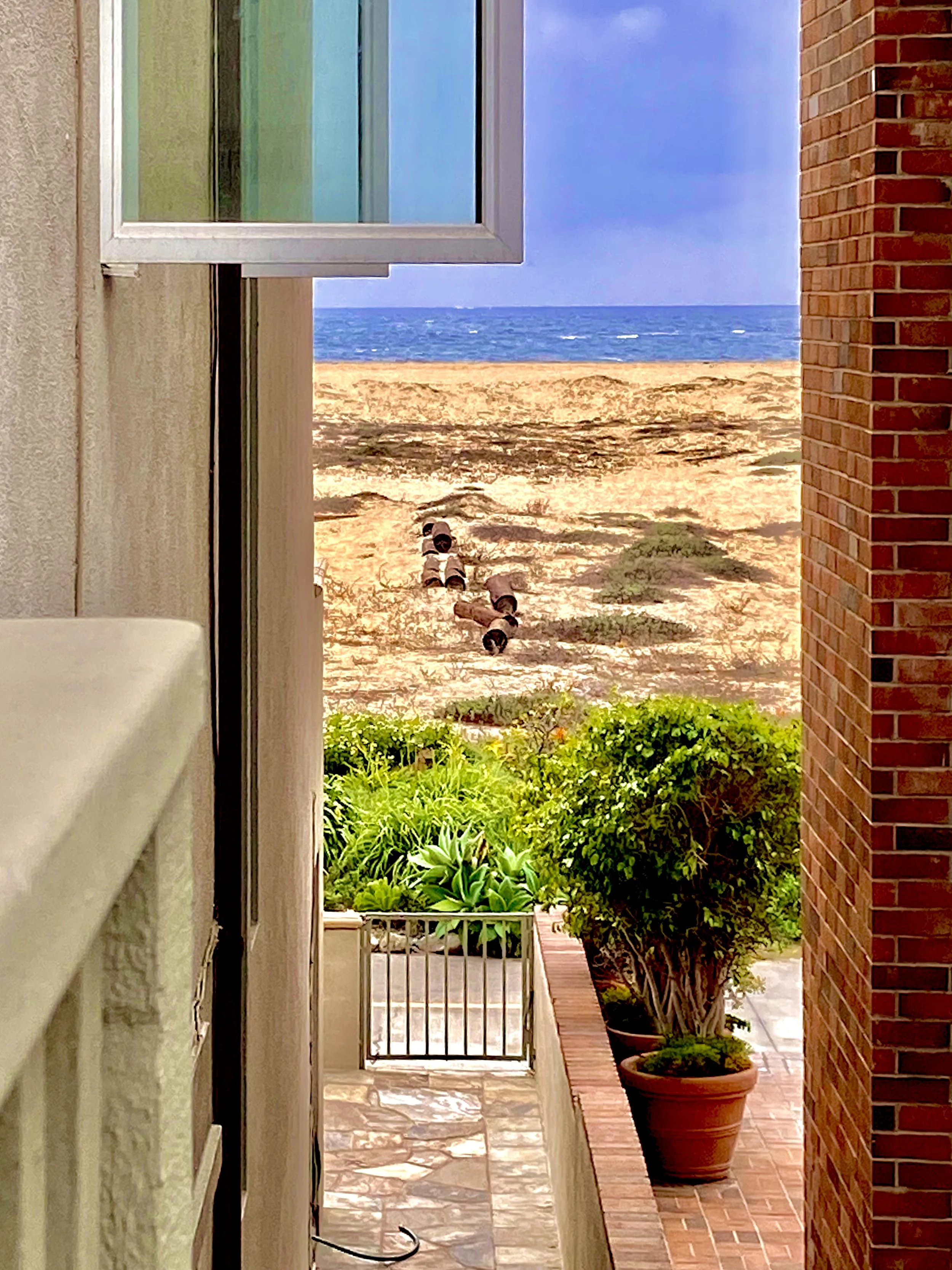 Oceanfront view from a beachfront home overlooking Newport Beach, California, and the Pacific Ocean.