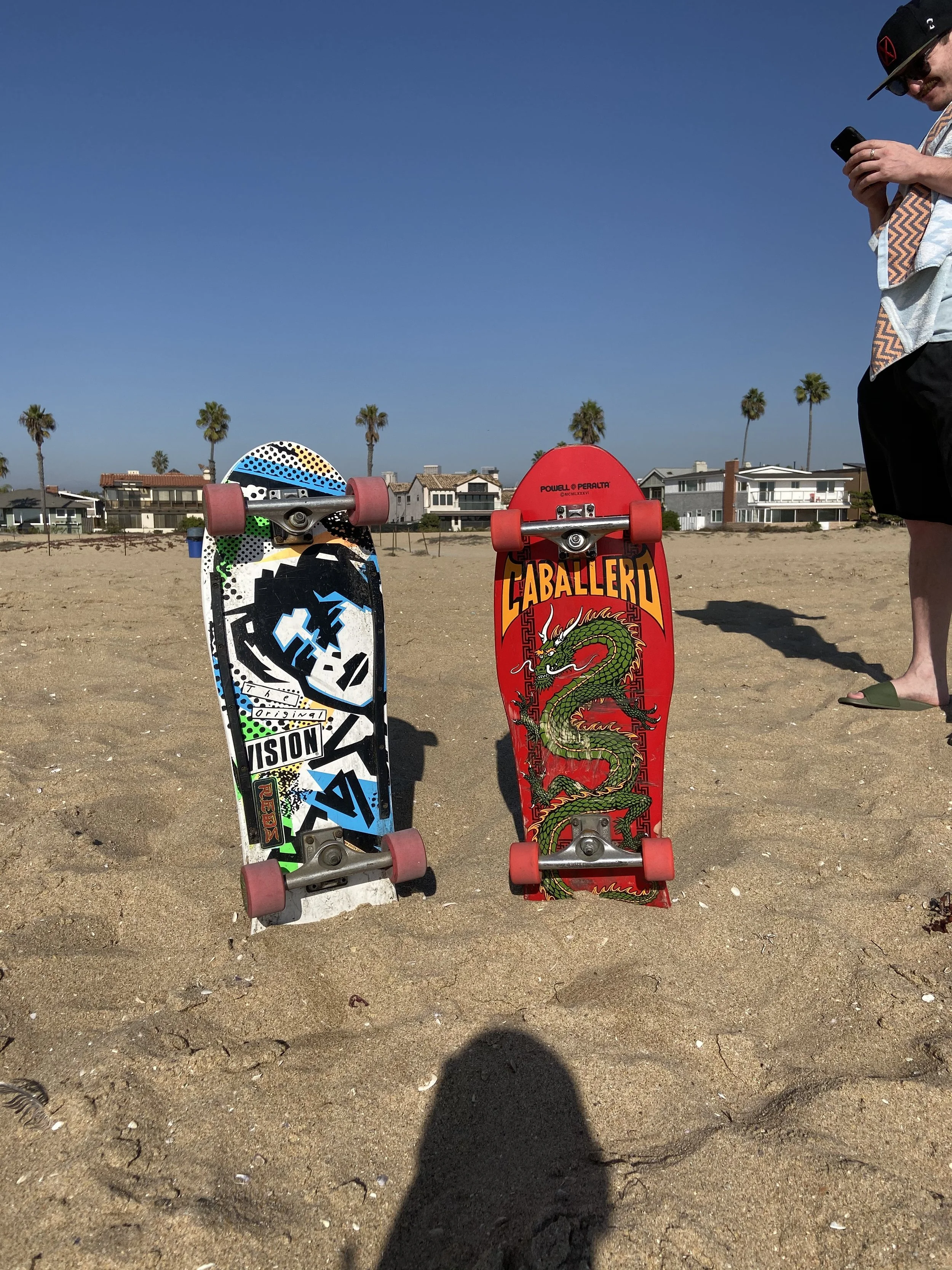 Skateboards on the sand at Newport Beach, California, near the Balboa Peninsula beach.