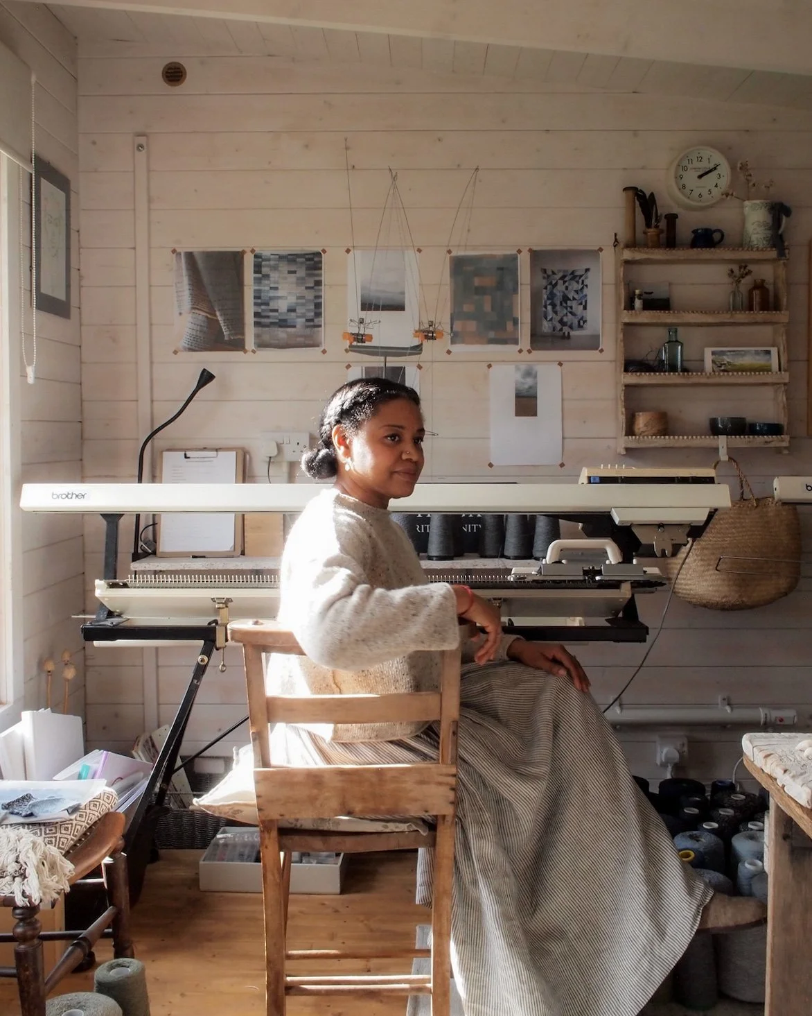 Jules Hogan sat in her light filled studio at a vintage knitting machine.