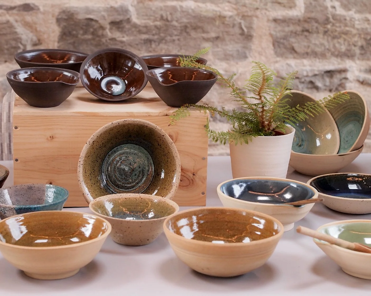 wheel turned ceramic by lisa dukes. natural shades of brown, ochre and grey blue