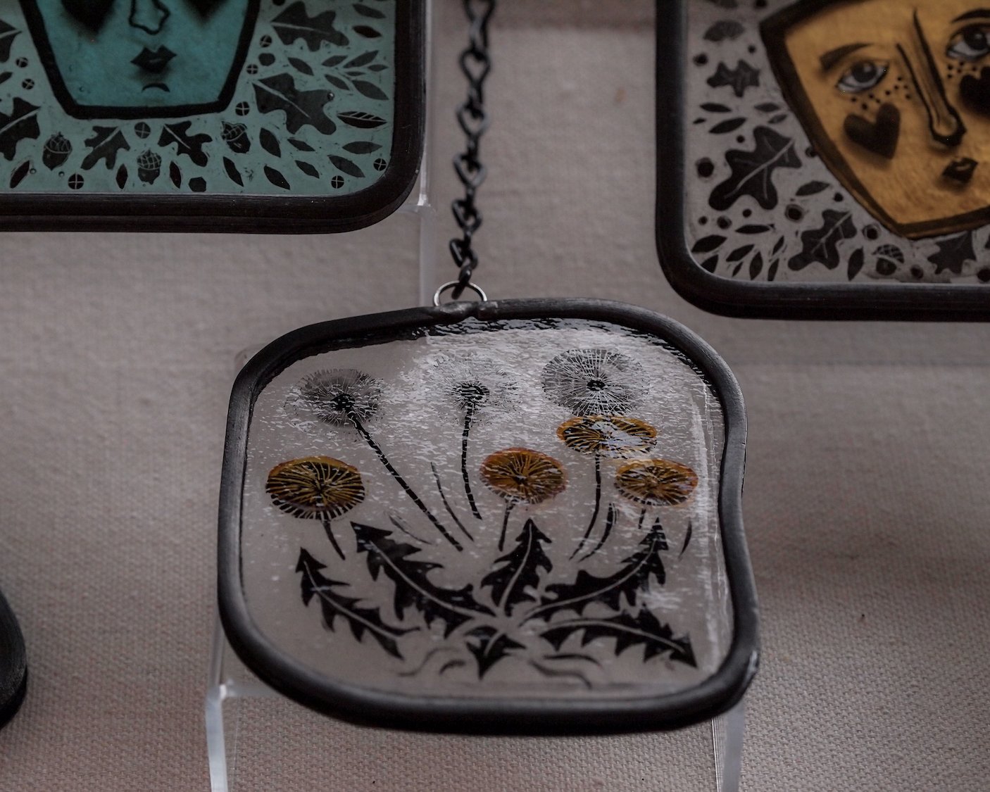 glass pendulim with dandilion design by luci clark