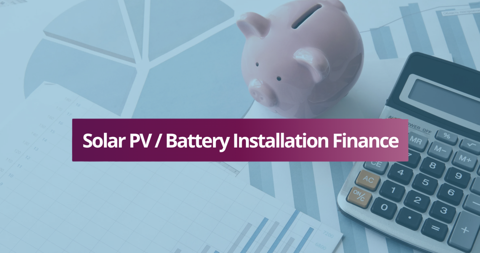 A pink piggy bank, a calculator, and financial charts on paper related to solar PV or battery installation finance.