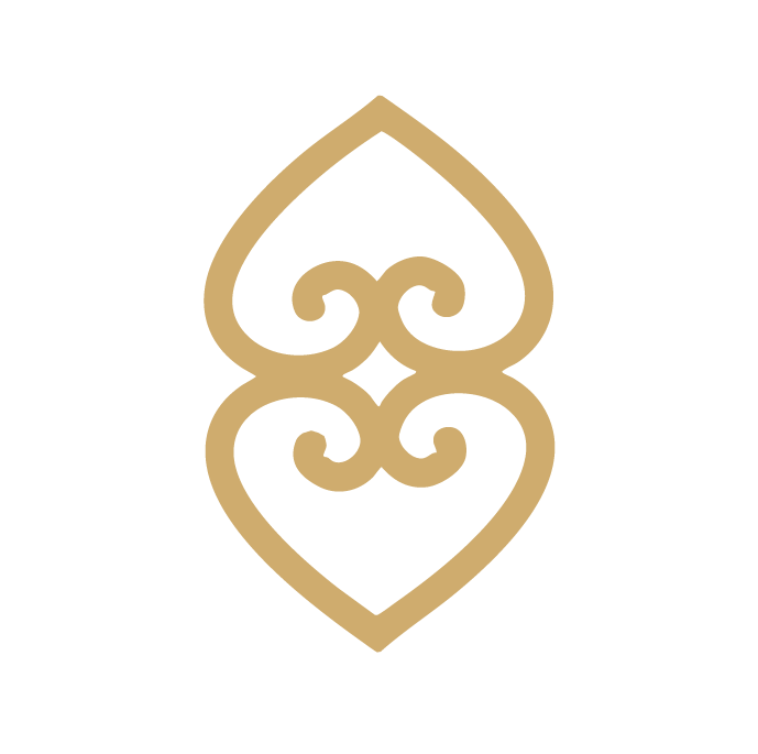 A gold decorative stylised double-heart motif.