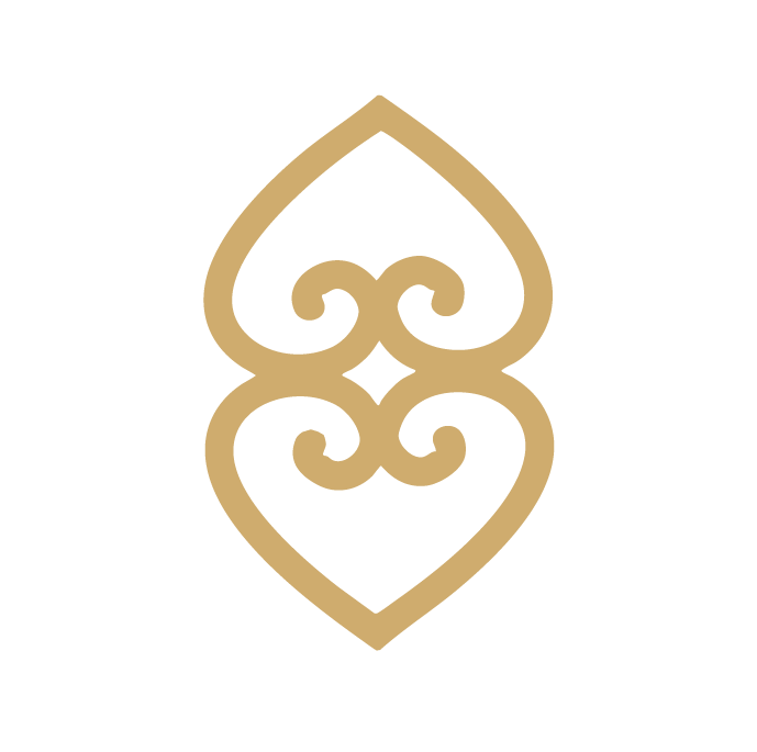 A gold decorative stylised double-heart motif.