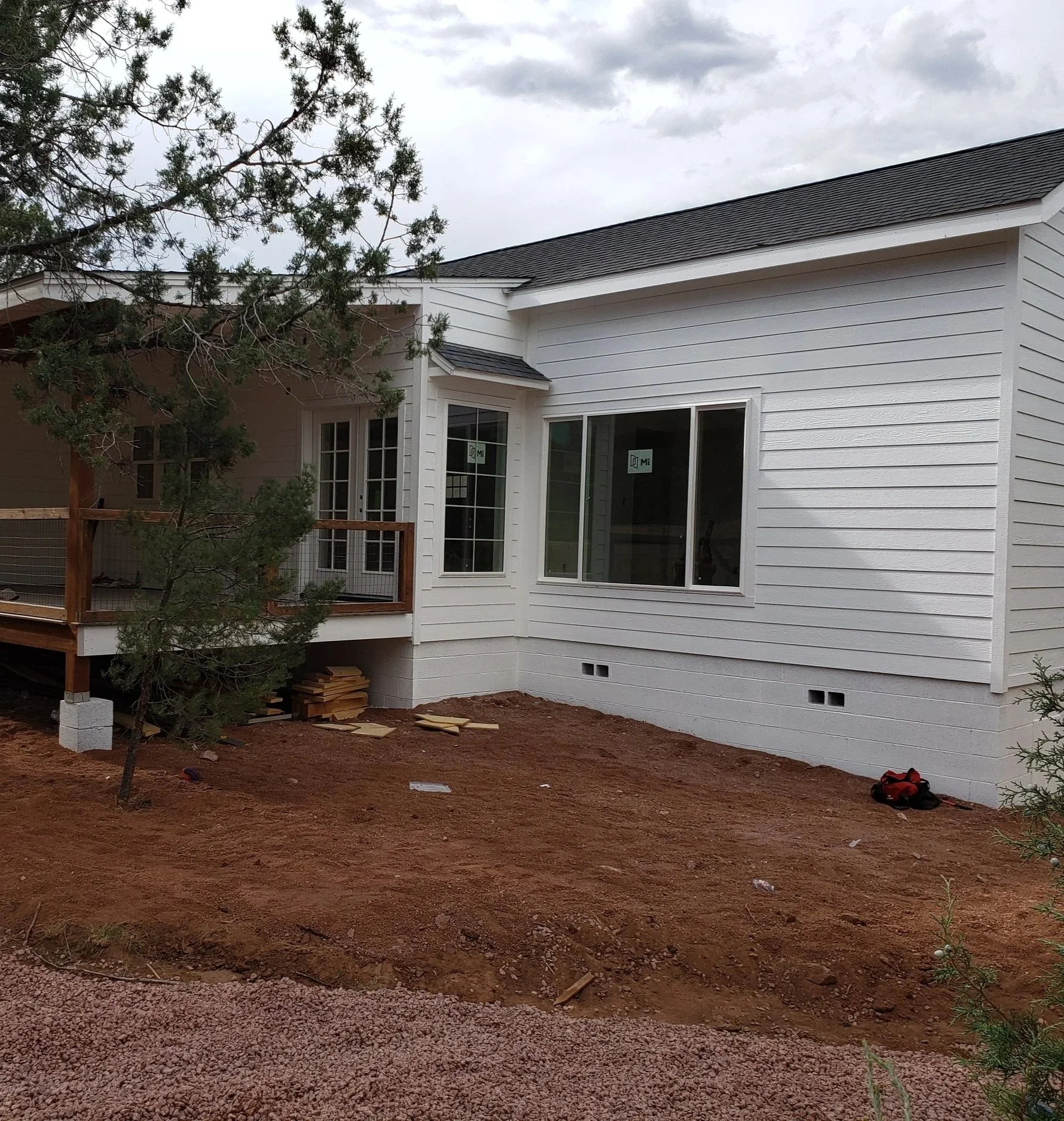 Gator Home Services- Payson- Garden Before Pic- Just Dirt on the ground next to a white house