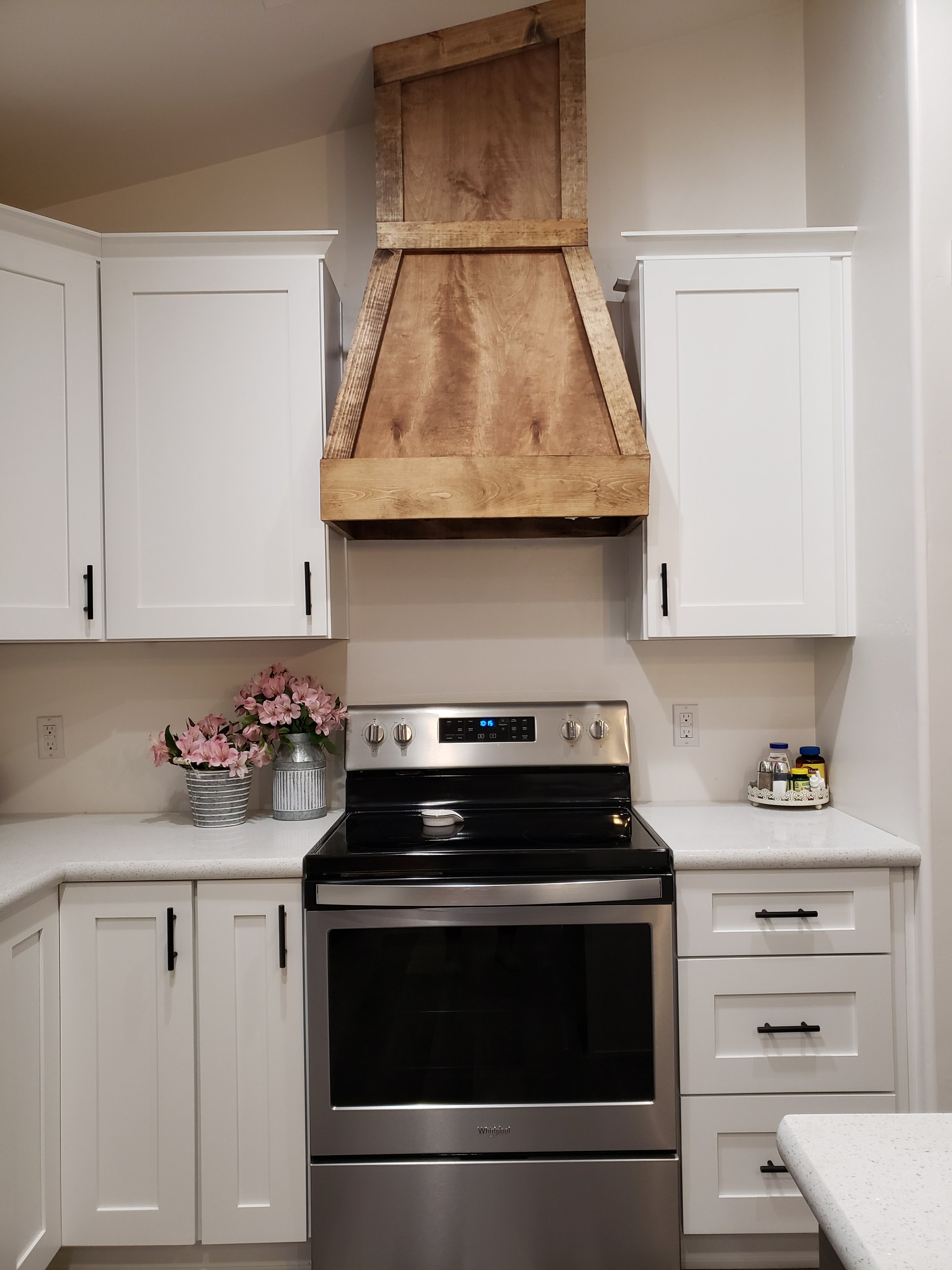 Gator Home Services- Payson- A White Kitchen with a custom made wood hood vent