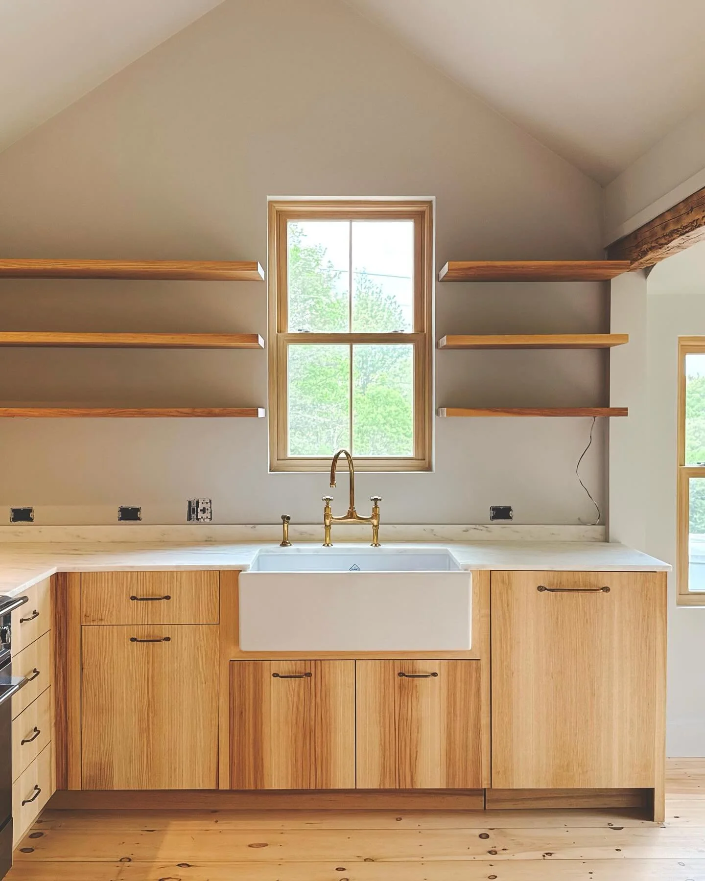 An easy favorite: quarter sawn ash kitchen and matching bathroom vanity. All verticle grain with shop sawn ash veneer appliance panels by @timothyrousseau 
handmade brass pulls by Devol and a thin 3/4&rdquo; marble countertop