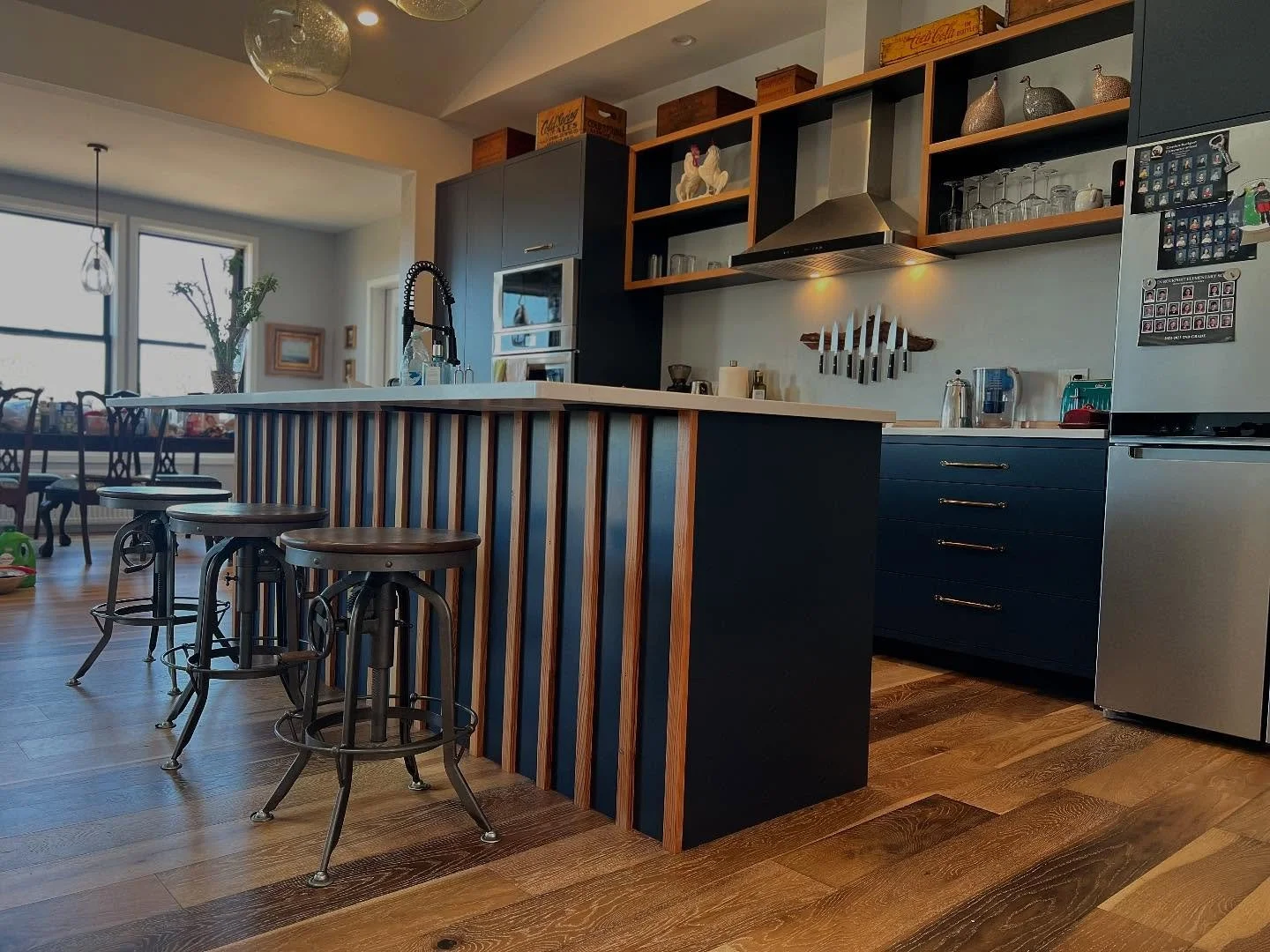 Newly painted navy blue kitchen with hand cast bronze pulls