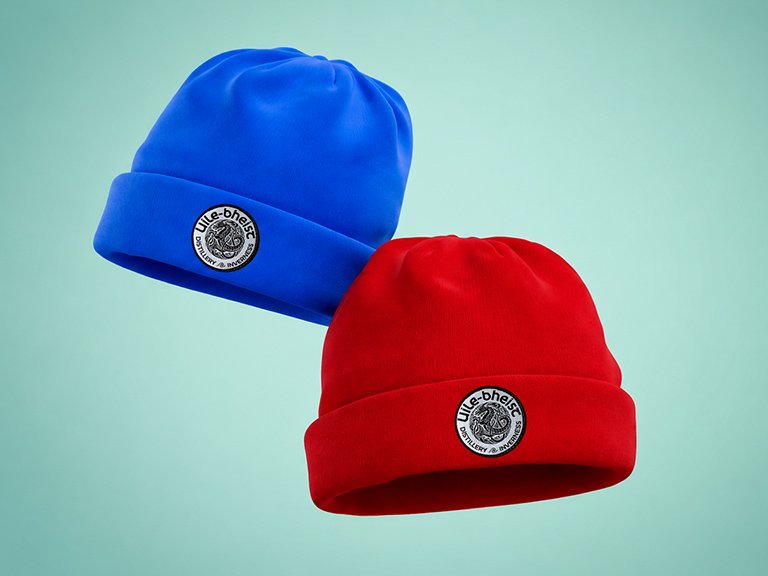 Uile-bheist beannie caps in red and blue, featuring embroidered distillery logo.
