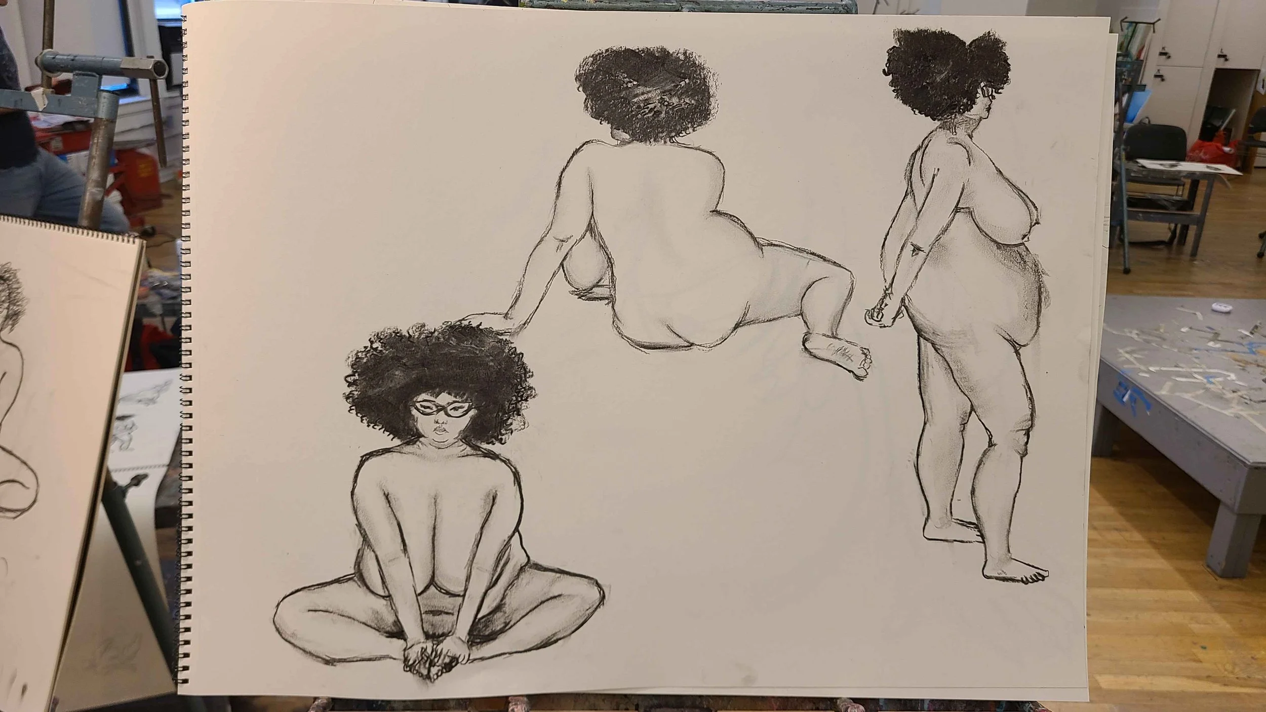 Drawing of four women with curly hair, depicted in different poses; one sitting on the ground with legs crossed and hands on feet, one sitting with back to the viewer, one sitting with knees up, and one standing with back slightly turned. All are top