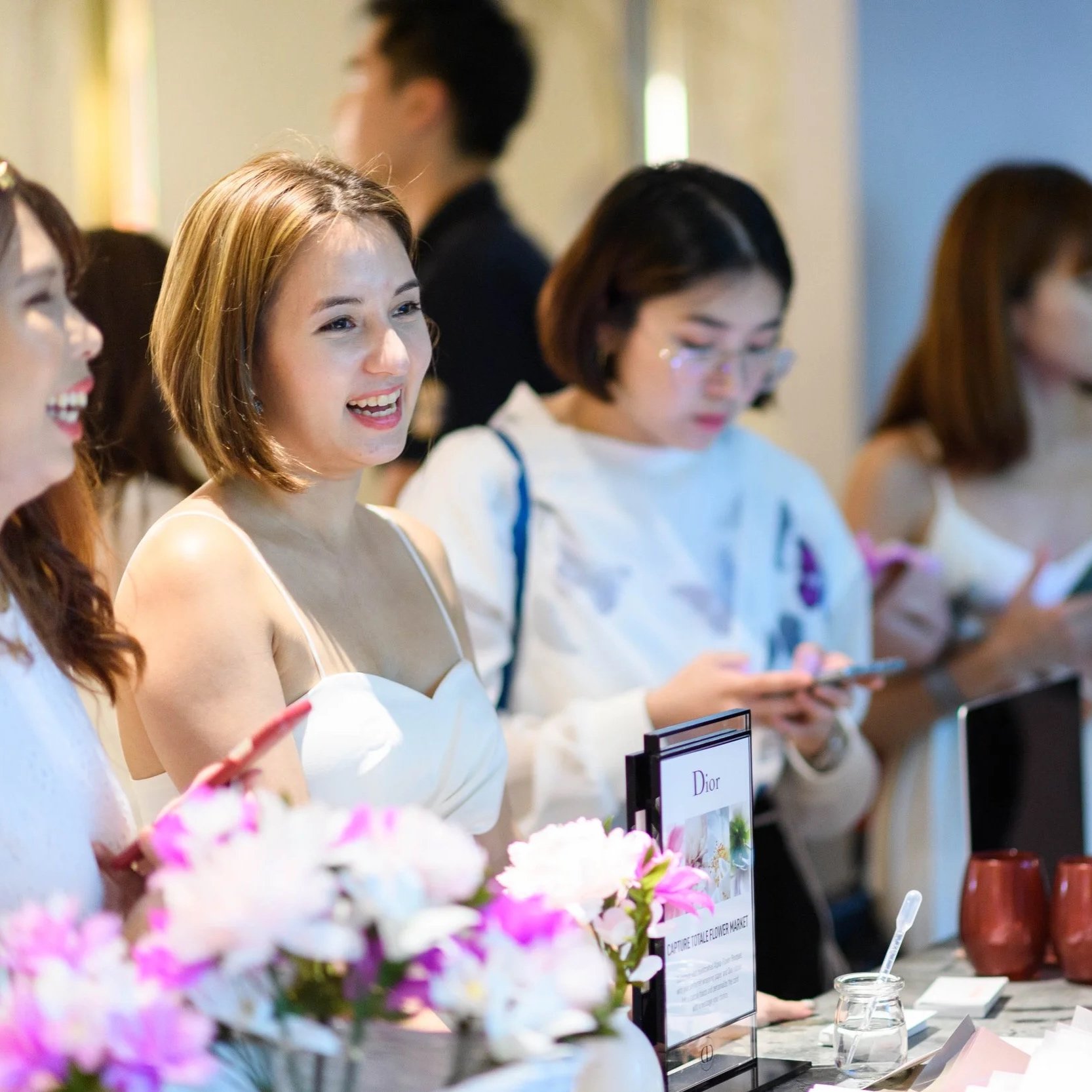 VIP guests waiting for their paper flower bouquets at Dior Singapore event.