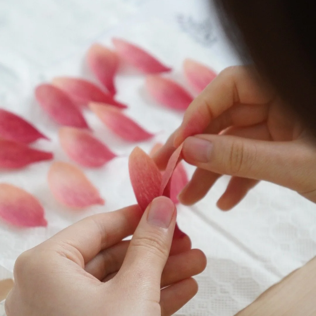 Merremade student works on a paper petal for her handmade paper flower in in-person workshop in Seoul Korea.