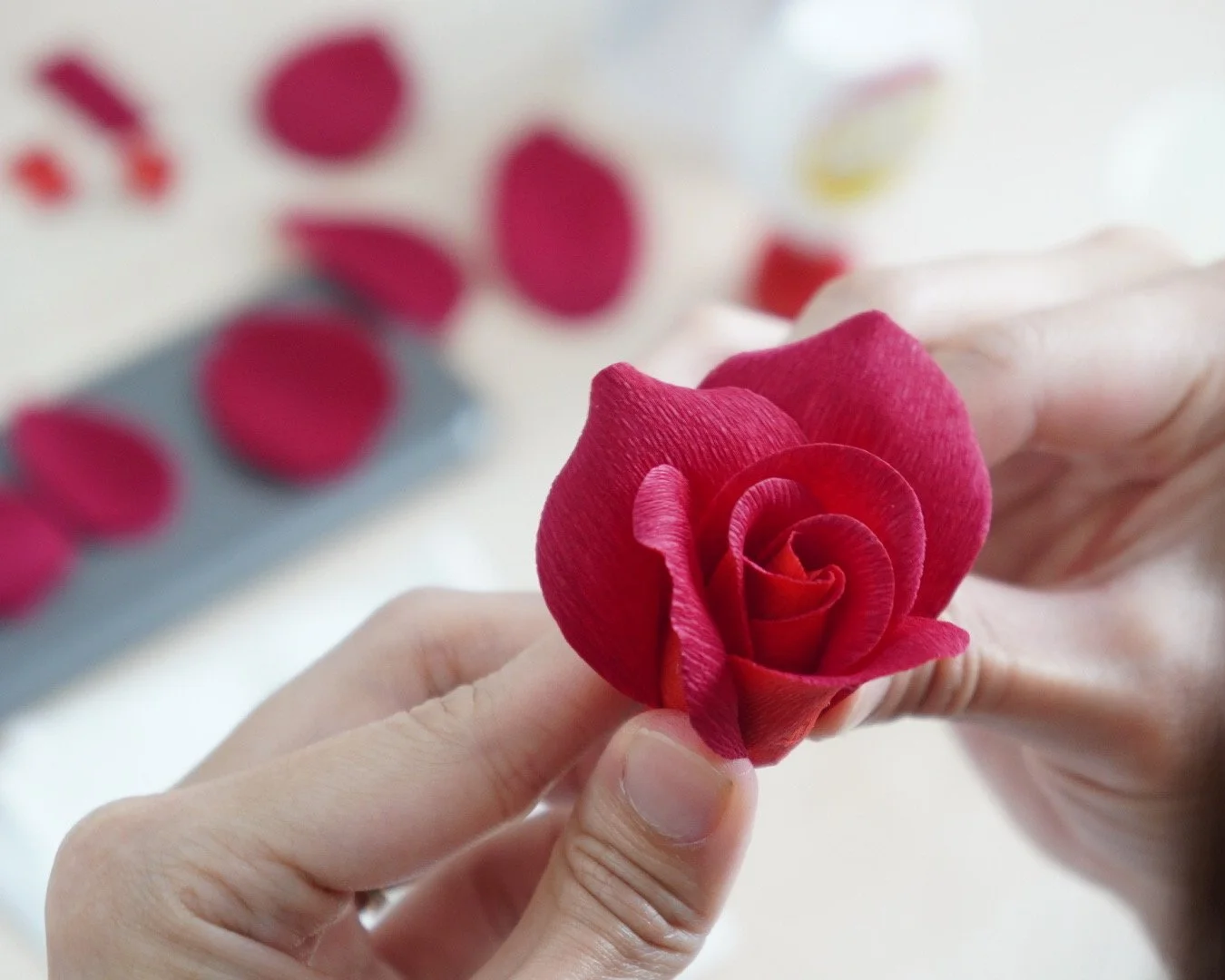 Merremade student making realistic paper rose during Seoul Korea workshop.
