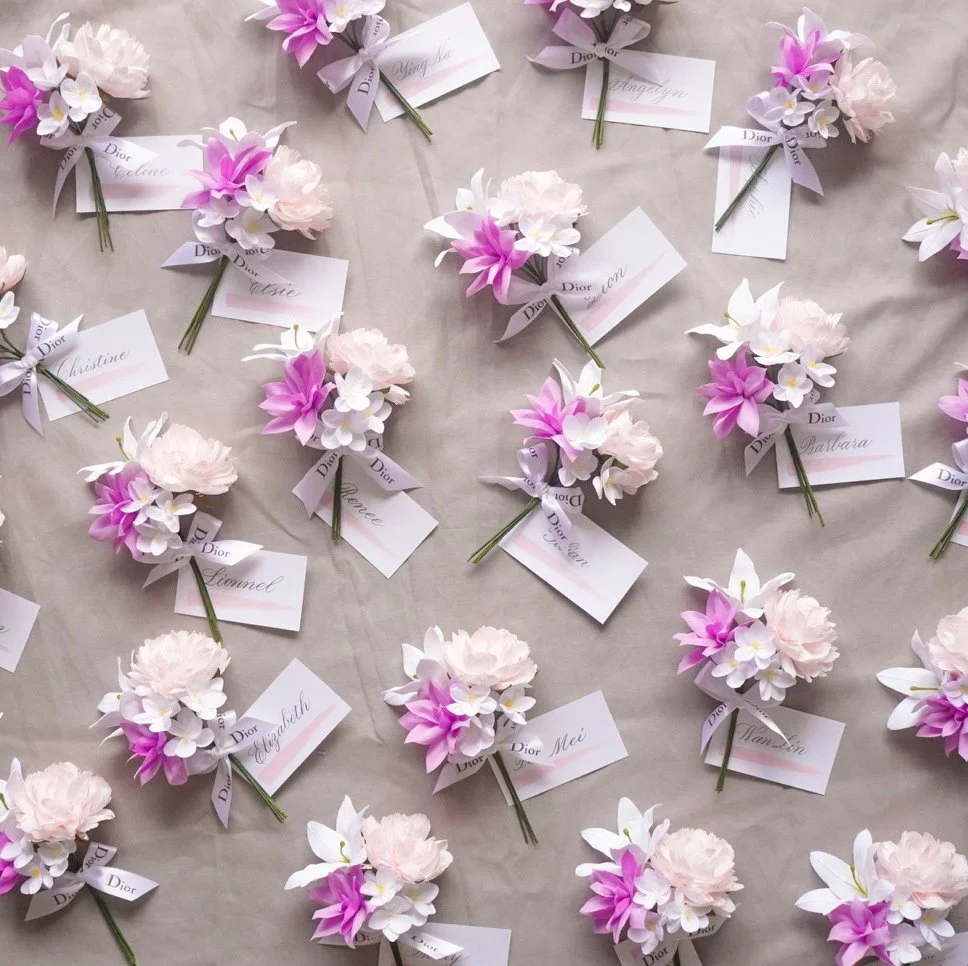 Jasmine Sing, paper artist from Merremade handcrafted these mini paper bouquets with name tags for Singapore Dior event.