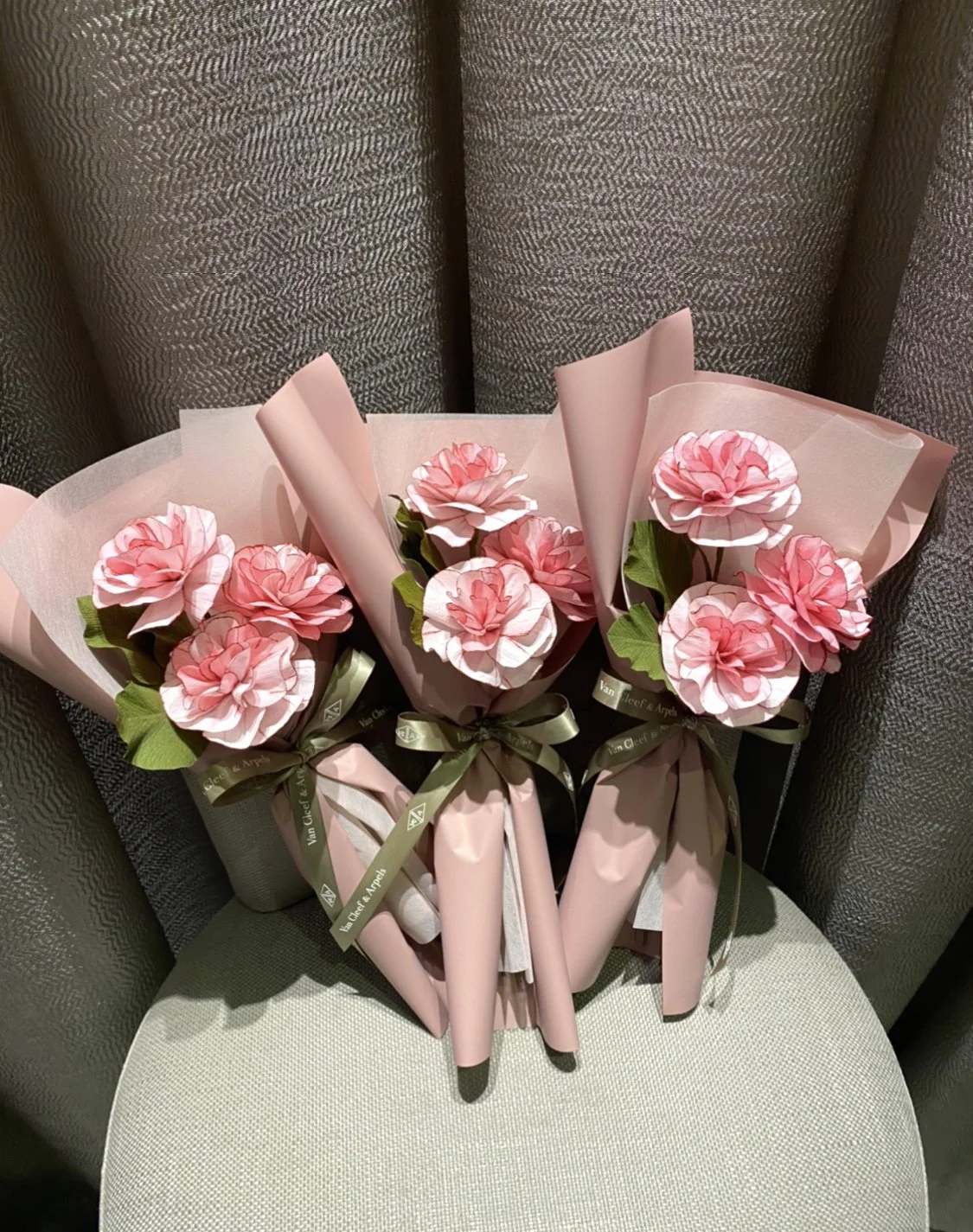 3 completed paper carnation bouquets by vip guests of Van Cleef & Arpels during a Singapore event. 